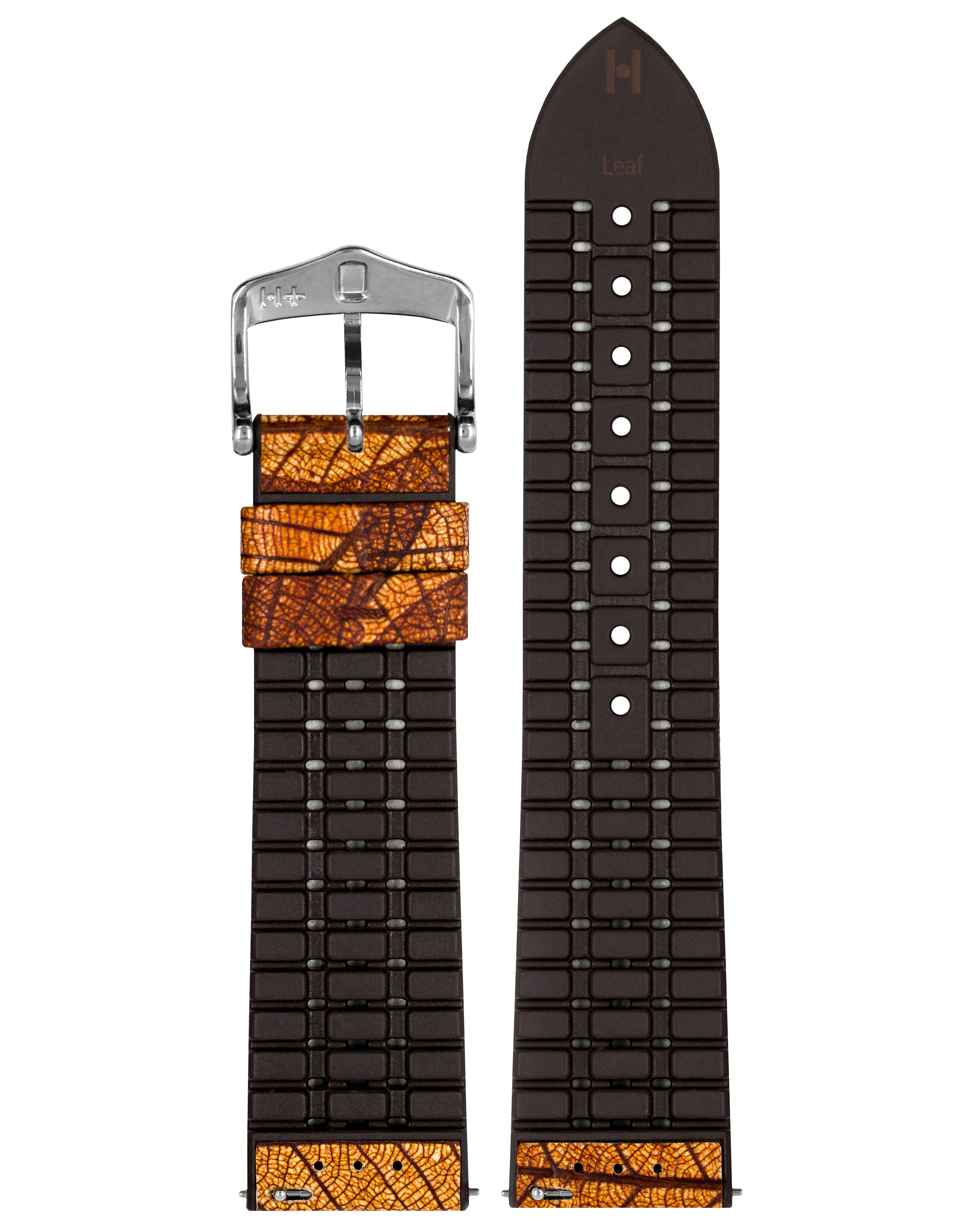 Uhrenarmband mit Blättermuster, schwarzem Gummi und Metallschnalle. Weißer Hintergrund.