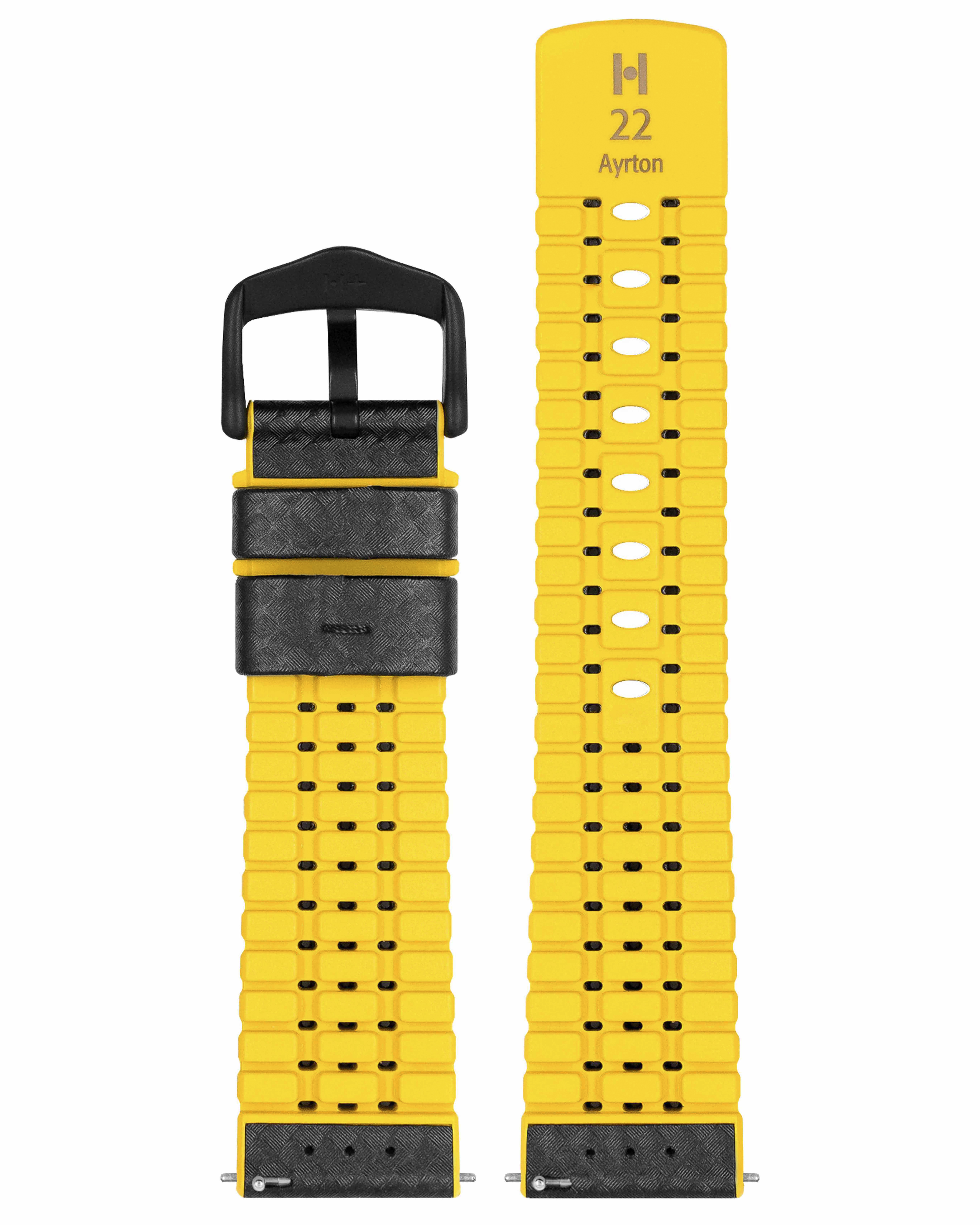 Gelbes Armband mit schwarzer Schnalle und Leder, mit den Zahlen 'H 22' und dem Namen 'Ayrton'.