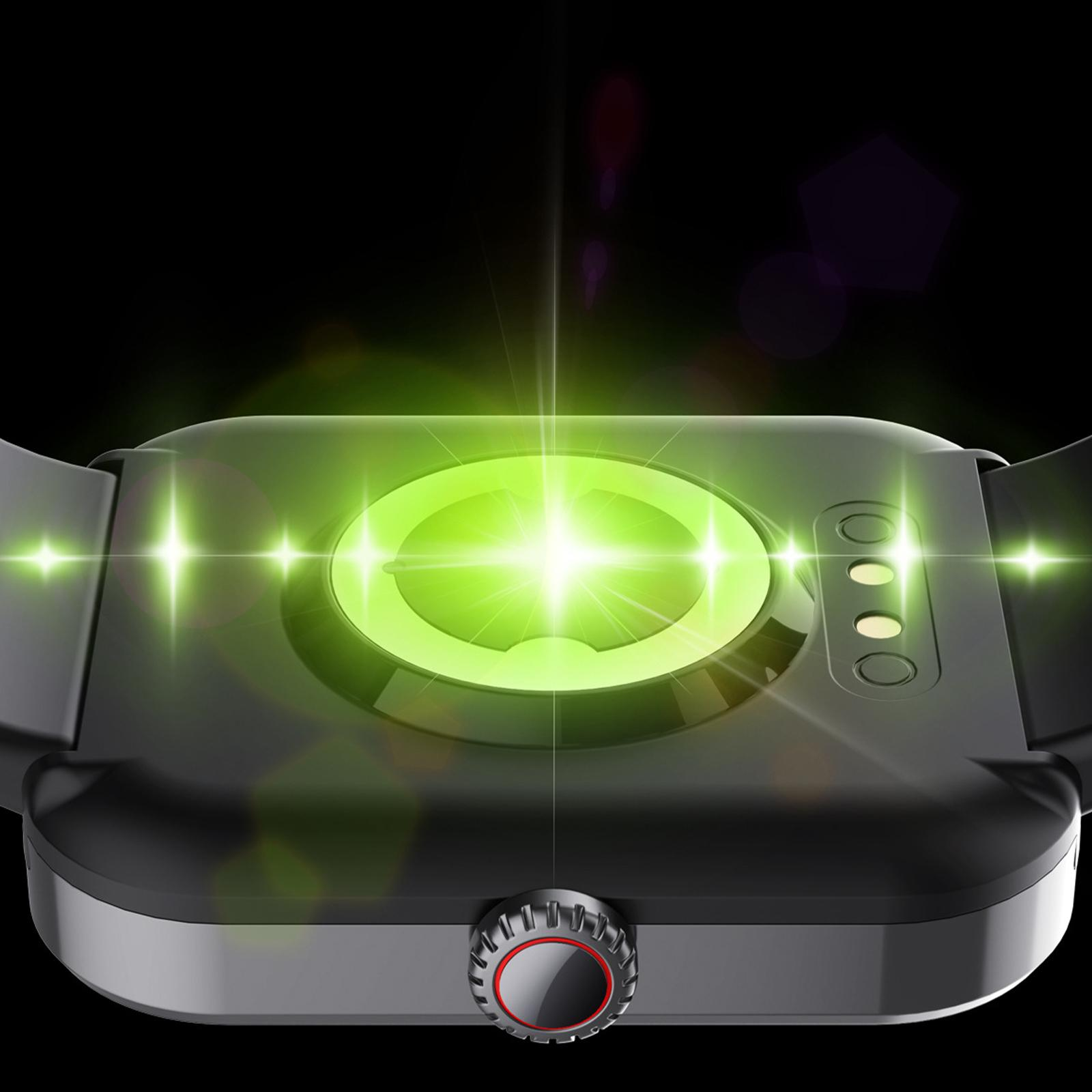 Die Unterseite einer Smartwatch-Ladestation, die grünes Licht aussendet, mit schwarzem Hintergrund.