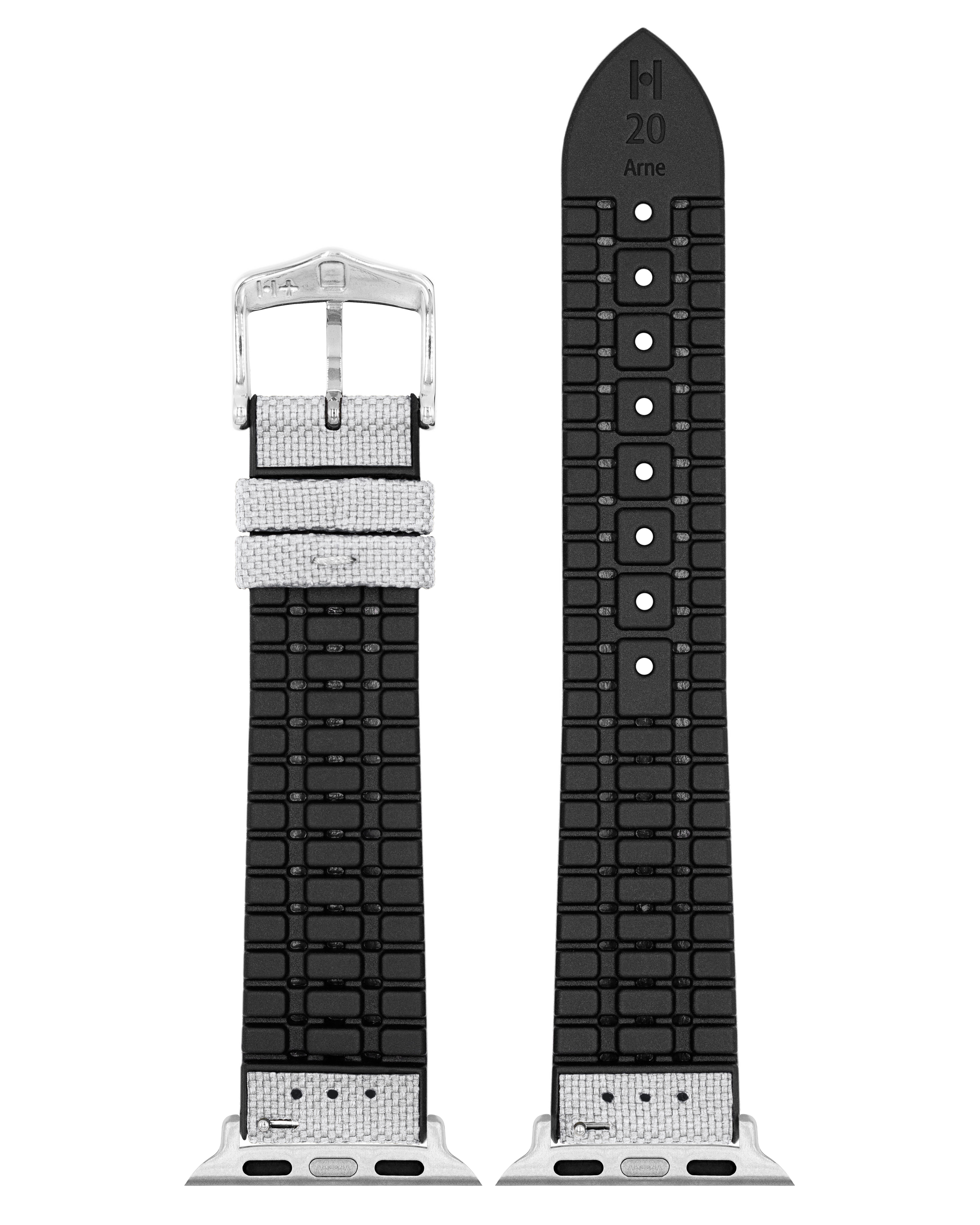 Graues und schwarzes Uhrenarmband mit silberner Schnalle. Das Band hat ein gemustertes Design.