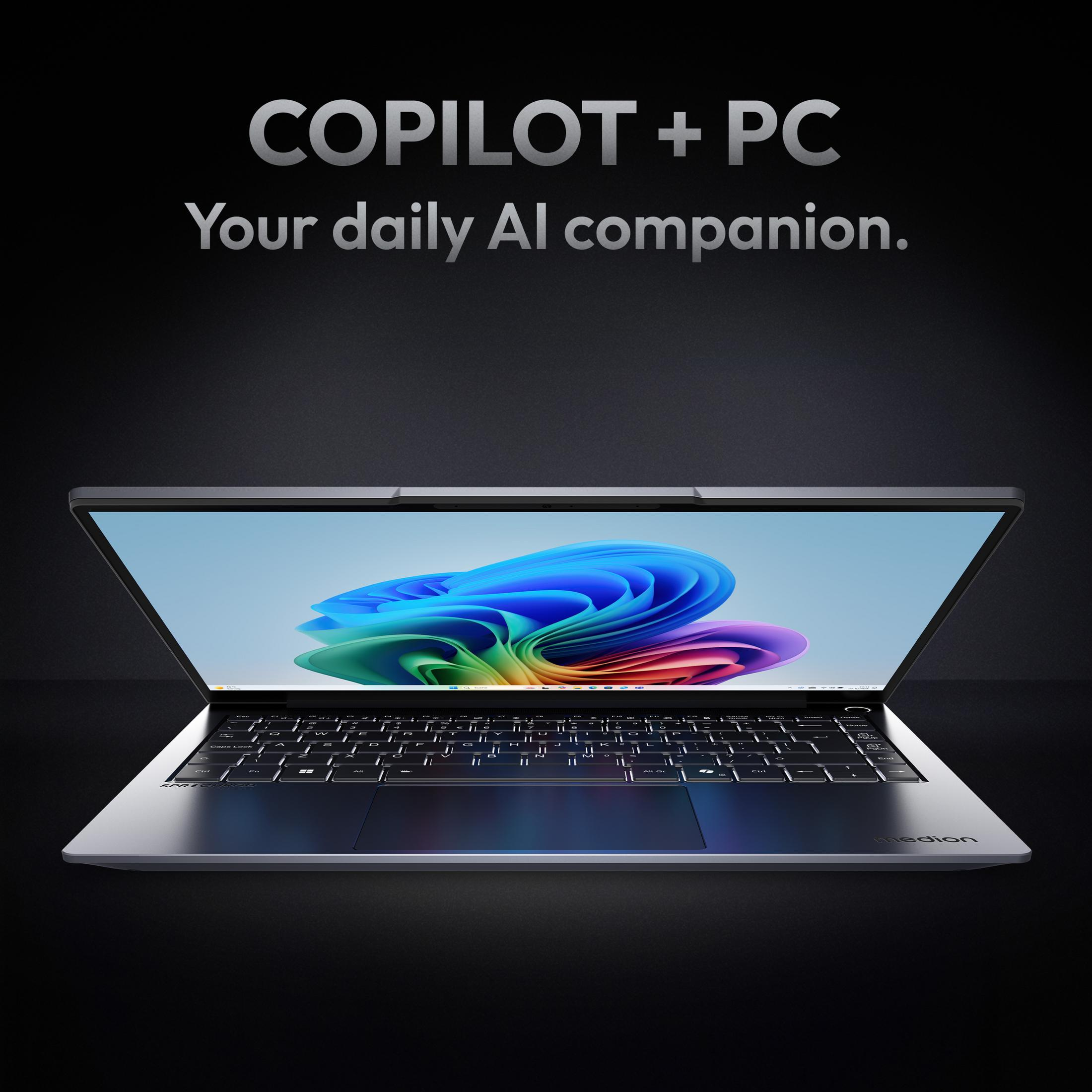 Ein Laptop vor dunklem Hintergrund mit dem Text 'COPILOT + PC Your daily AI companion'.