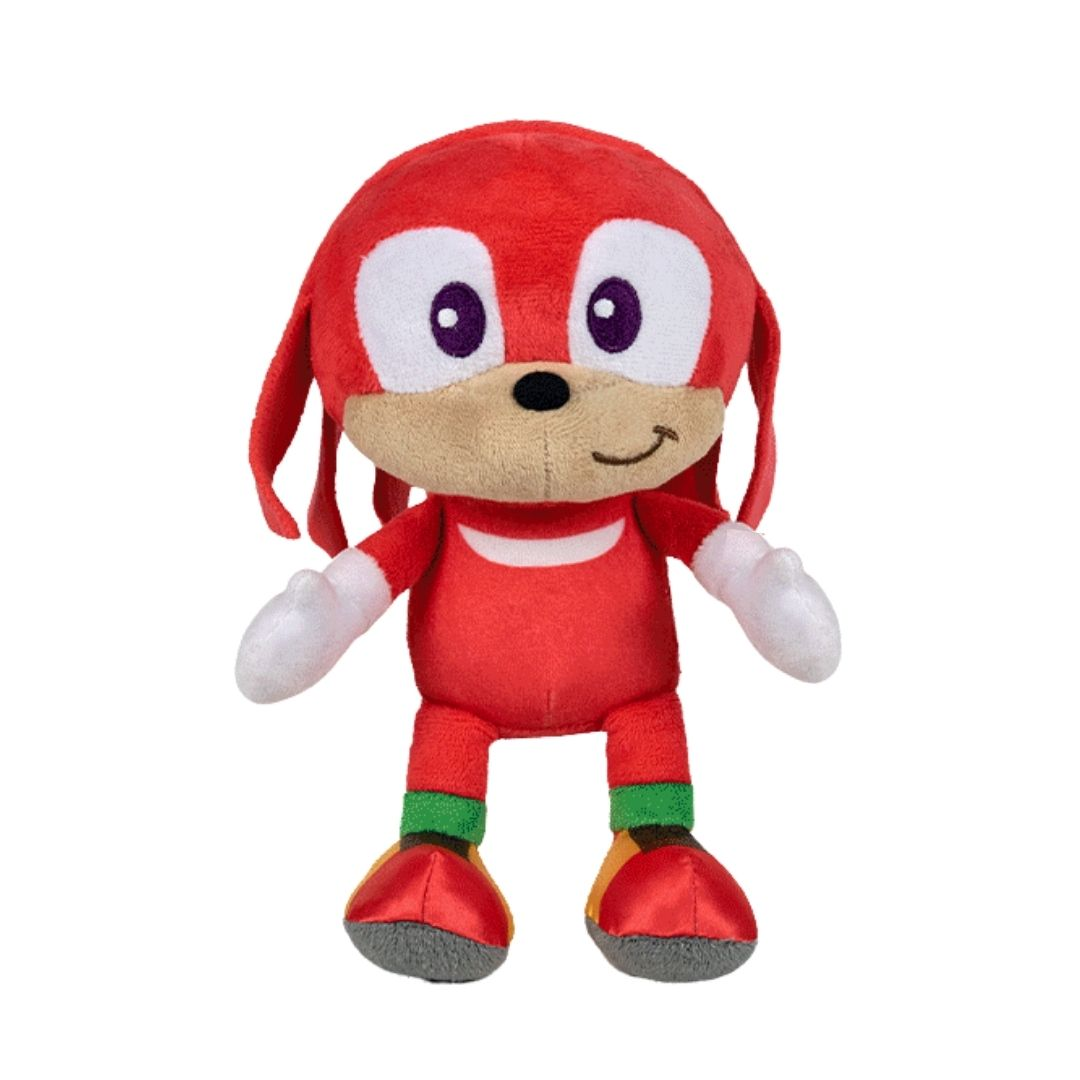 Ein rotes Knuckles-Plüschtier mit weißen Handschuhen und einem Lächeln, vor weißem Hintergrund.