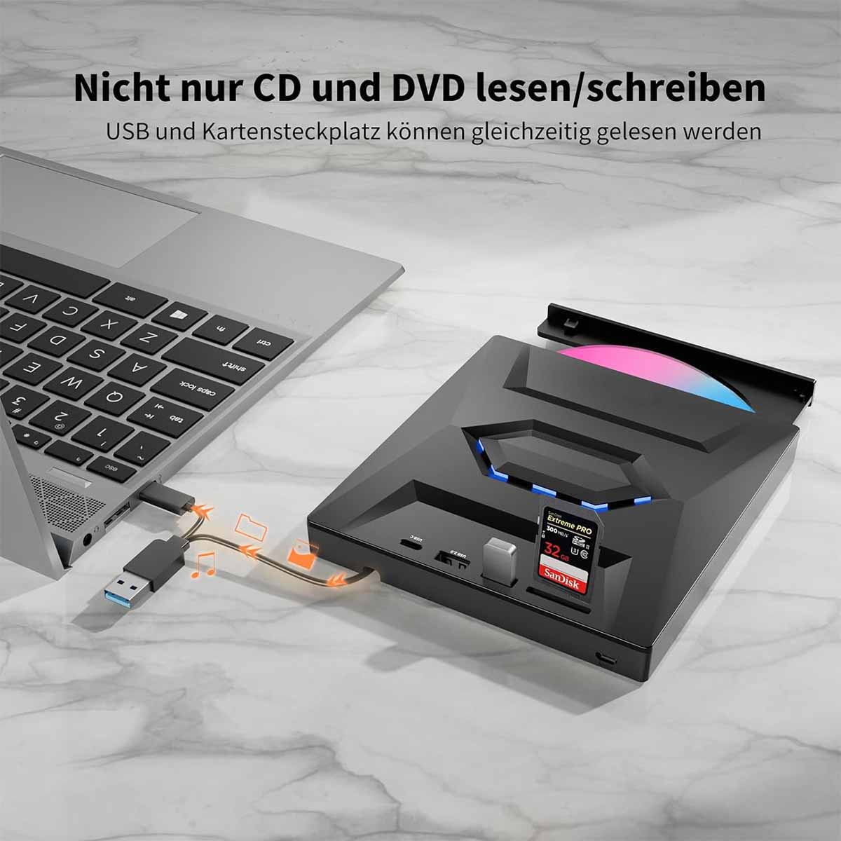 Unità CD/DVD con un laptop e una chiavetta USB inserita. È inserita anche una scheda SD. L'unità si trova su una superficie di marmo.
