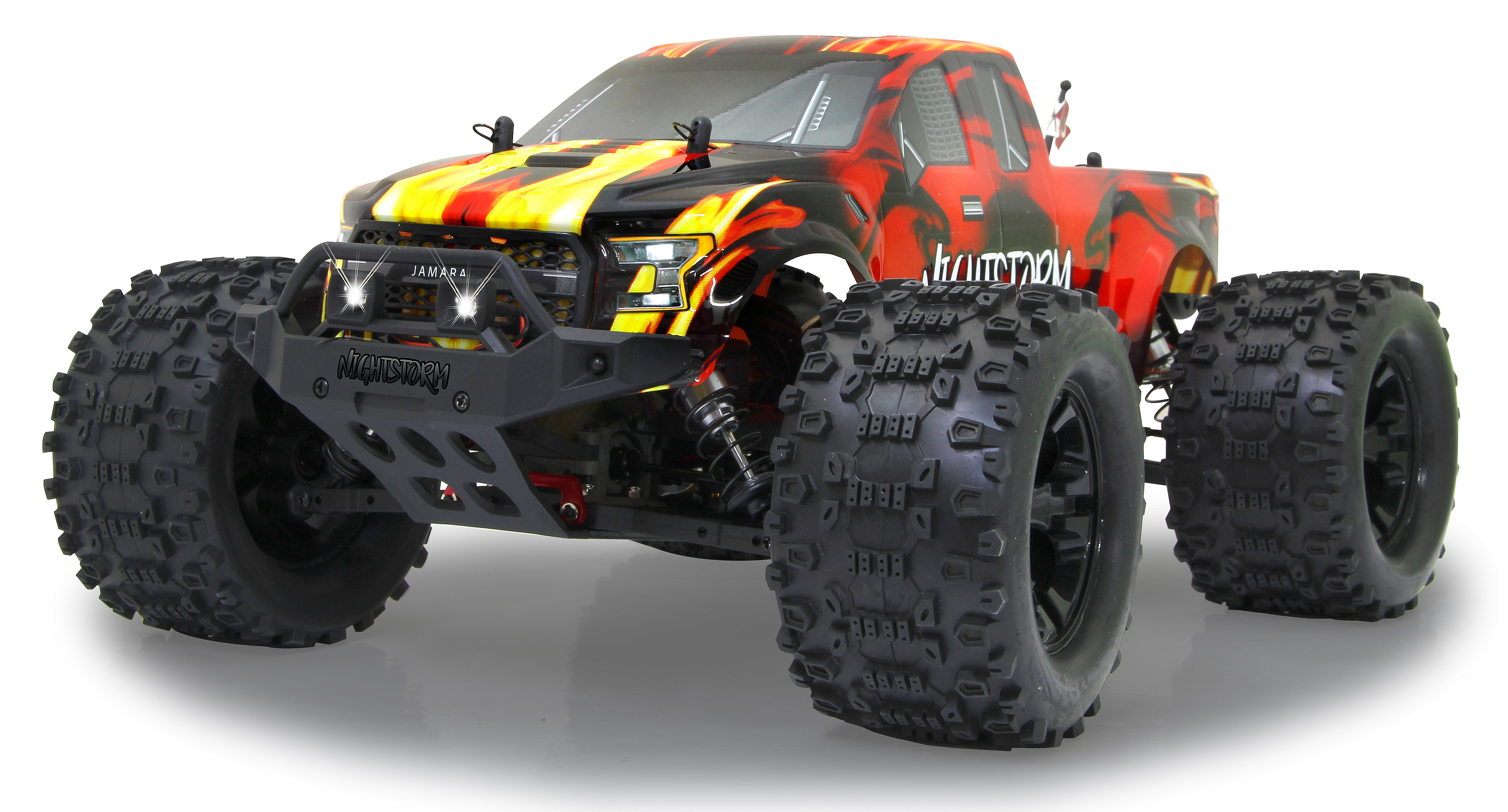 Ein rotes und schwarzes Monstertruck-Spielzeug. Es hat große Reifen und das Wort NIGHTSTORM.