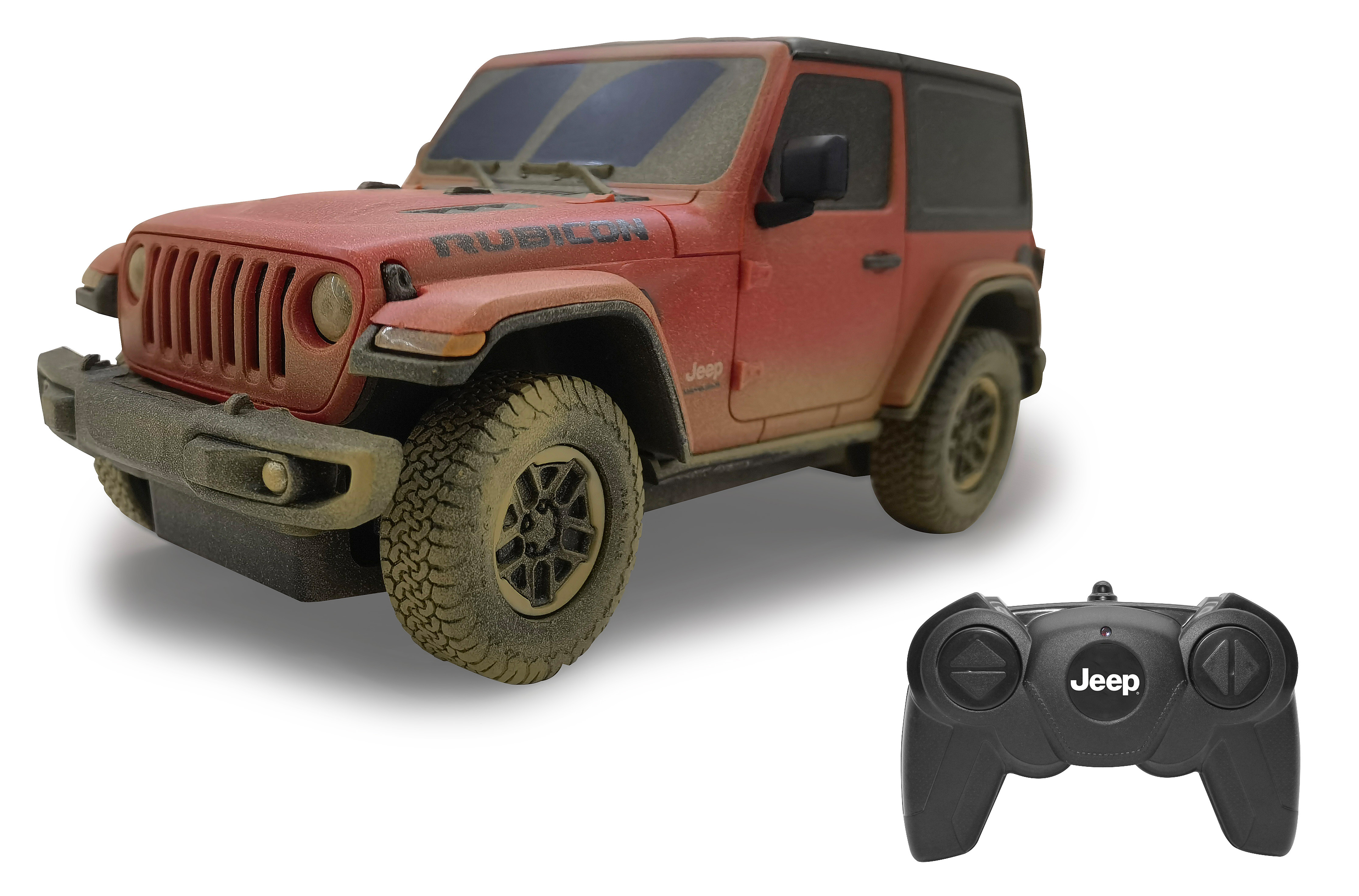 Rotes Jeep-Spielzeugauto mit Controller. Die Räder sind schmutzig.