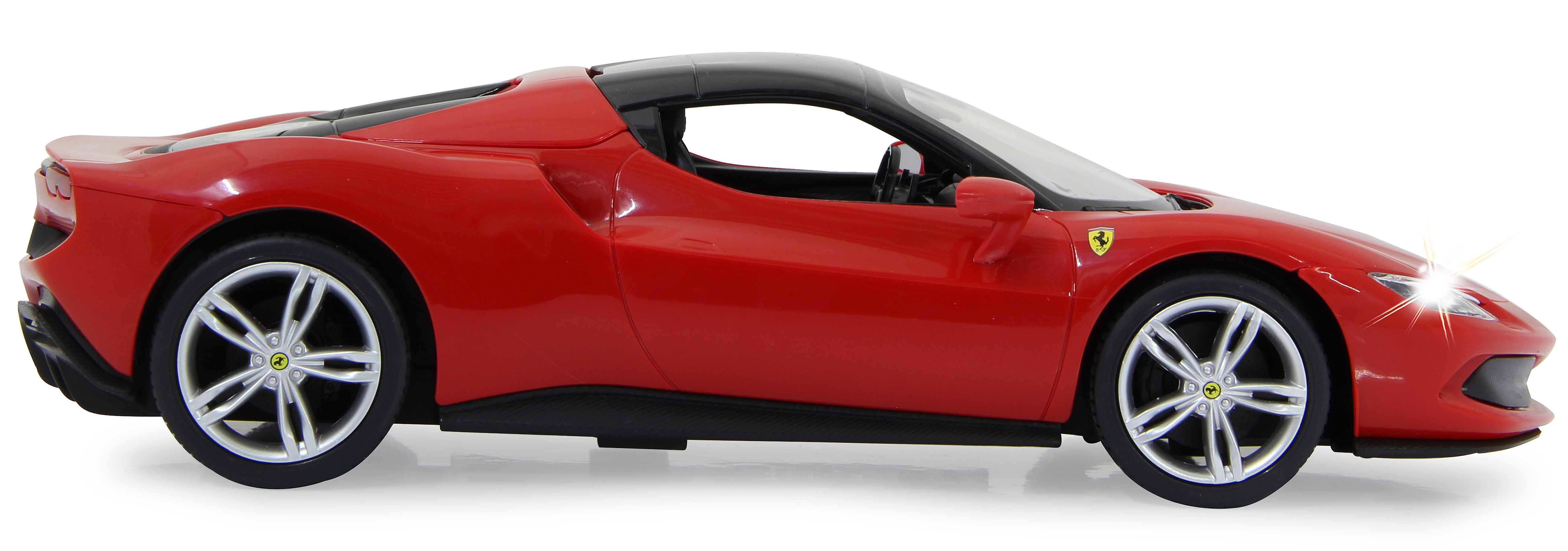 Rotes Ferrari-Modellauto von der Seite, schwarzes Dach, weiße Räder, Scheinwerfer an.