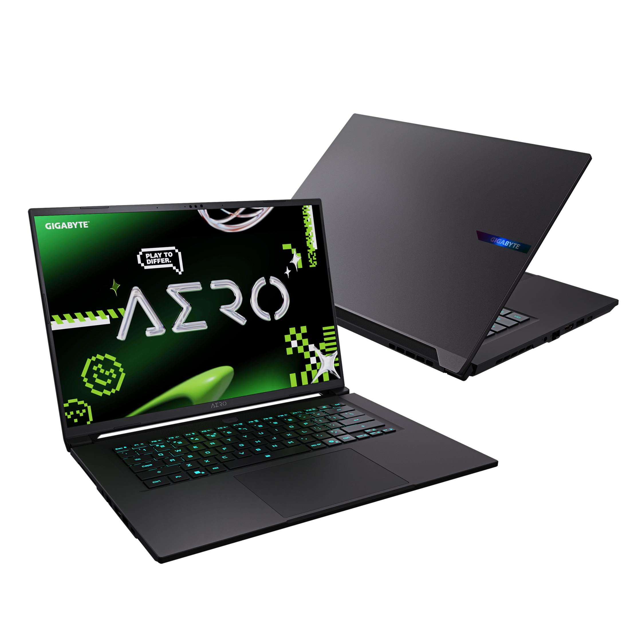 Czarny laptop z podświetlaną na zielono klawiaturą. Jest otwarty, a drugi zamknięty za nim.