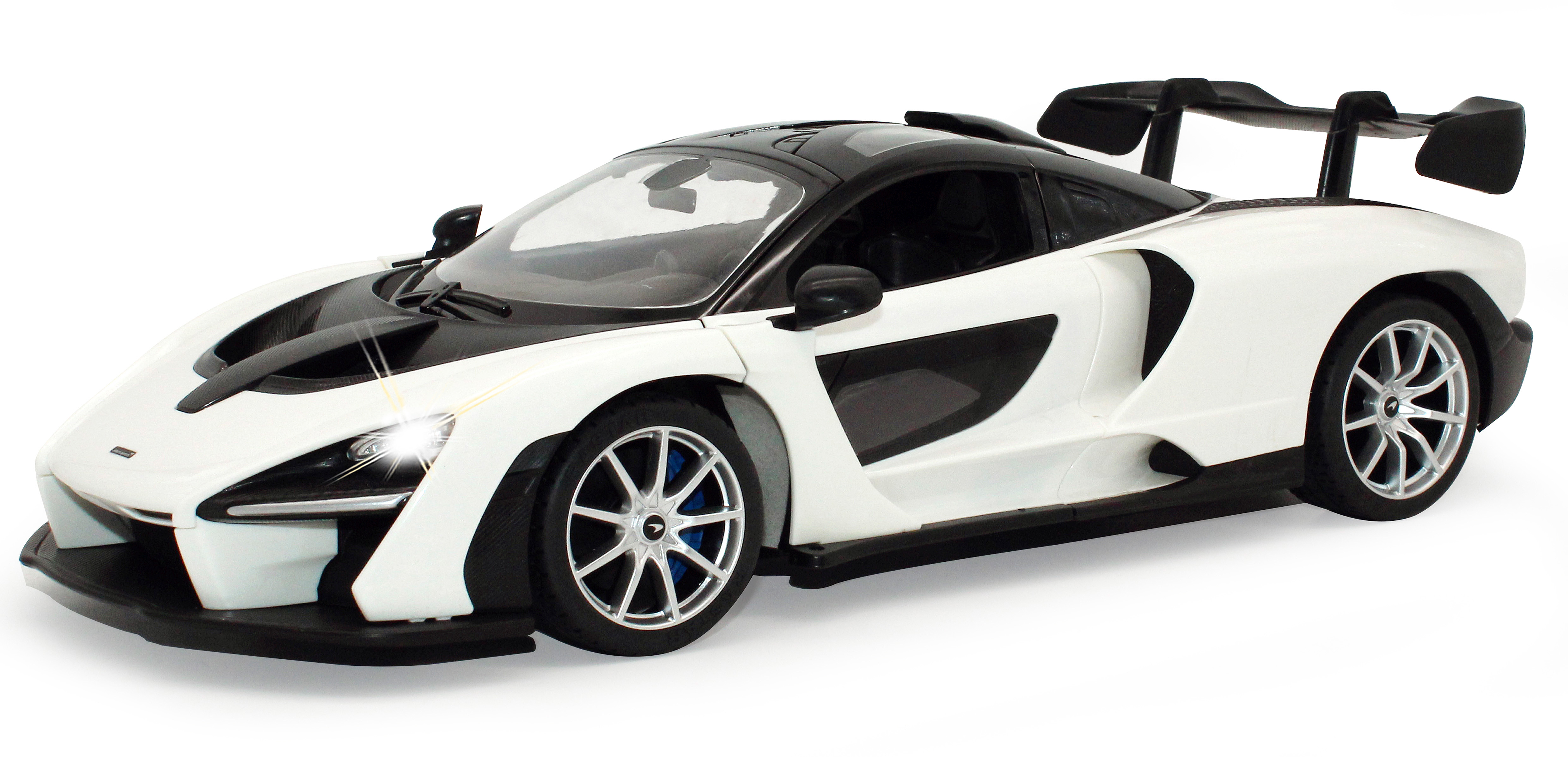 Ein weißes McLaren Senna Spielzeugauto mit schwarzem Dach und schwarzen Akzenten. Das Auto steht auf weißem Hintergrund.