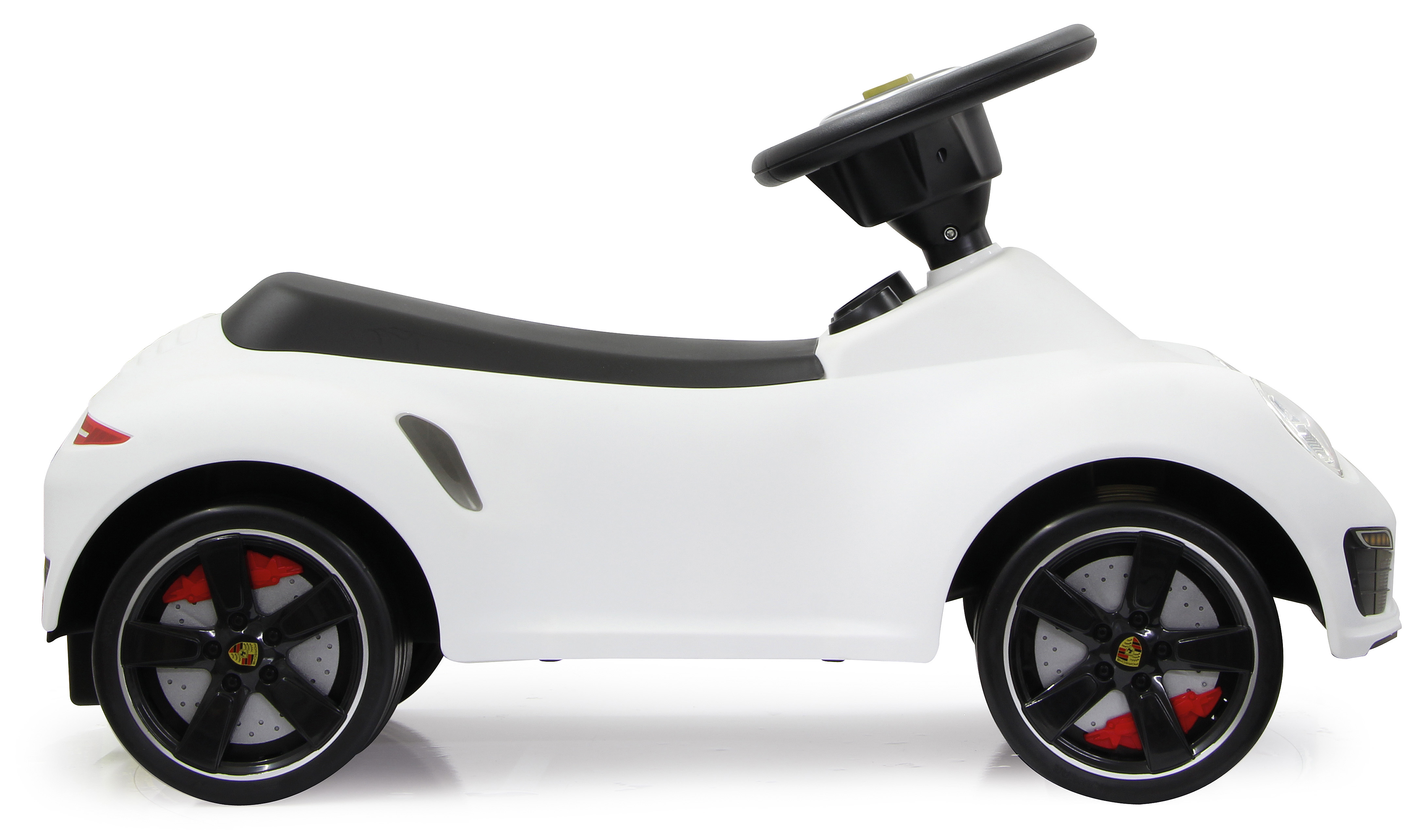 Weißes Spielzeugauto für Kinder mit schwarzem Sitz und Lenkrad. Rote Bremsdetails.