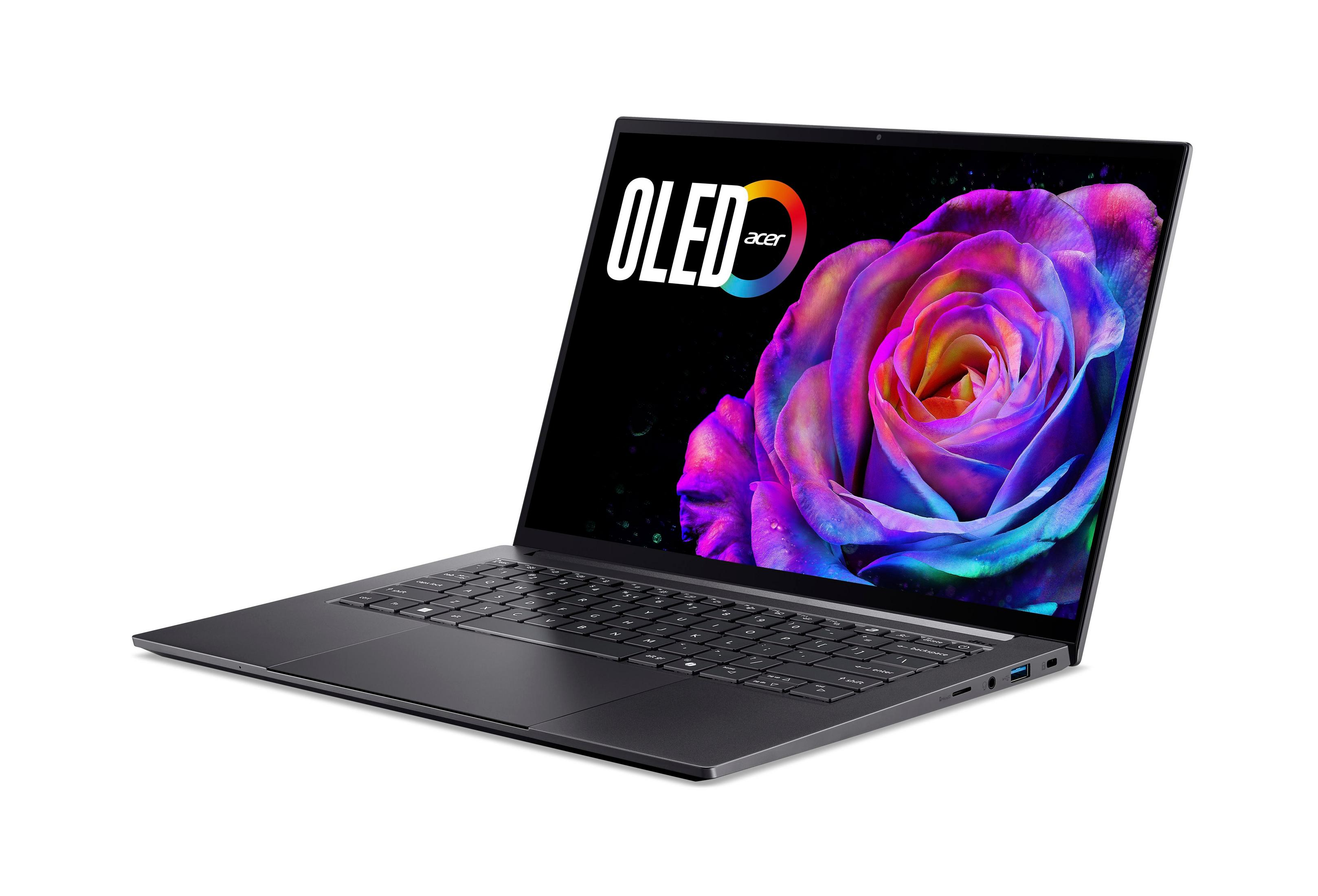 Laptop z ekranem OLED wyświetlającym kolorową różę. Logo Acer jest widoczne. Jest na białym tle.