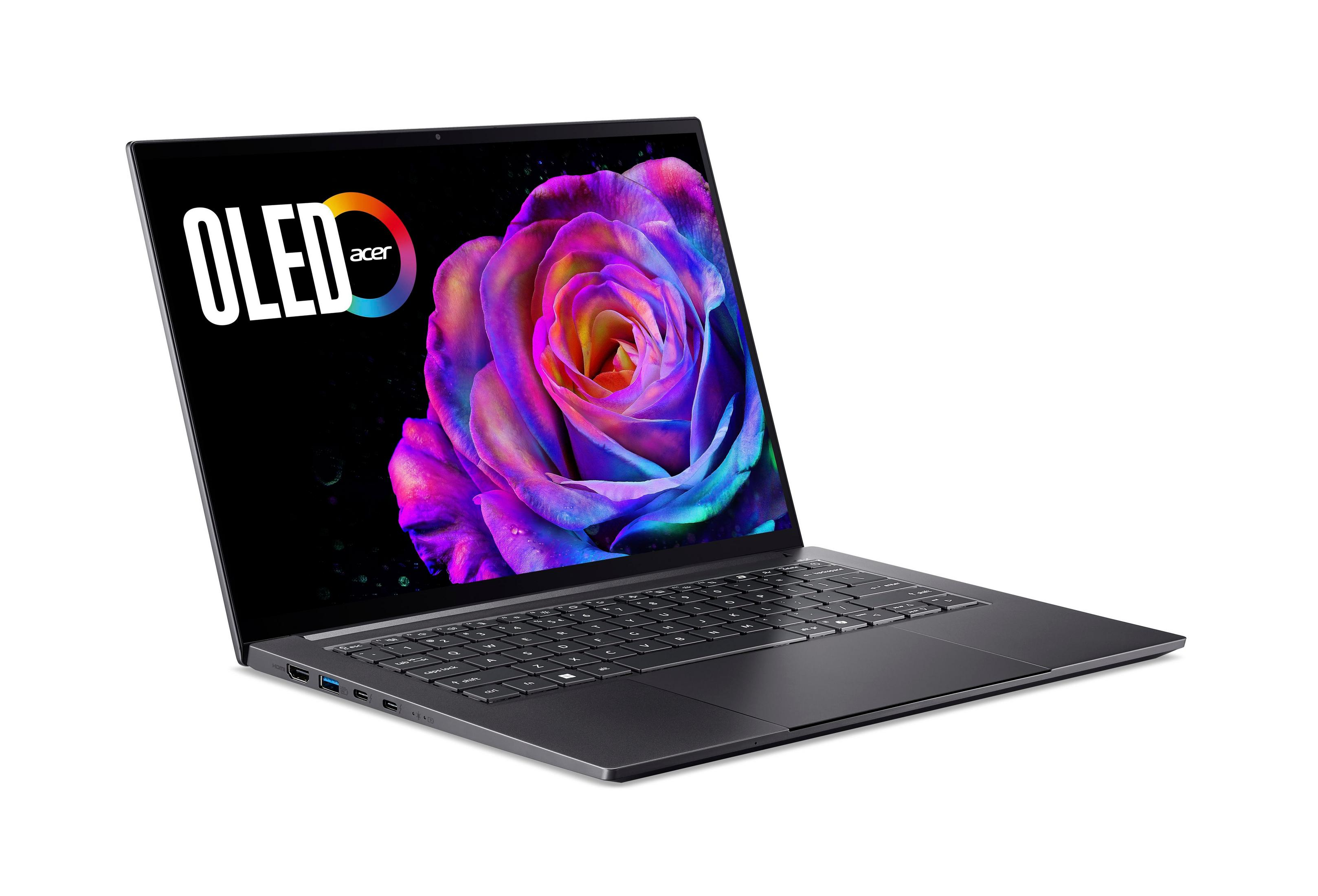 Laptop z ekranem OLED wyświetlającym kolorową różę. Logo Acer jest widoczne. Jest na białym tle.