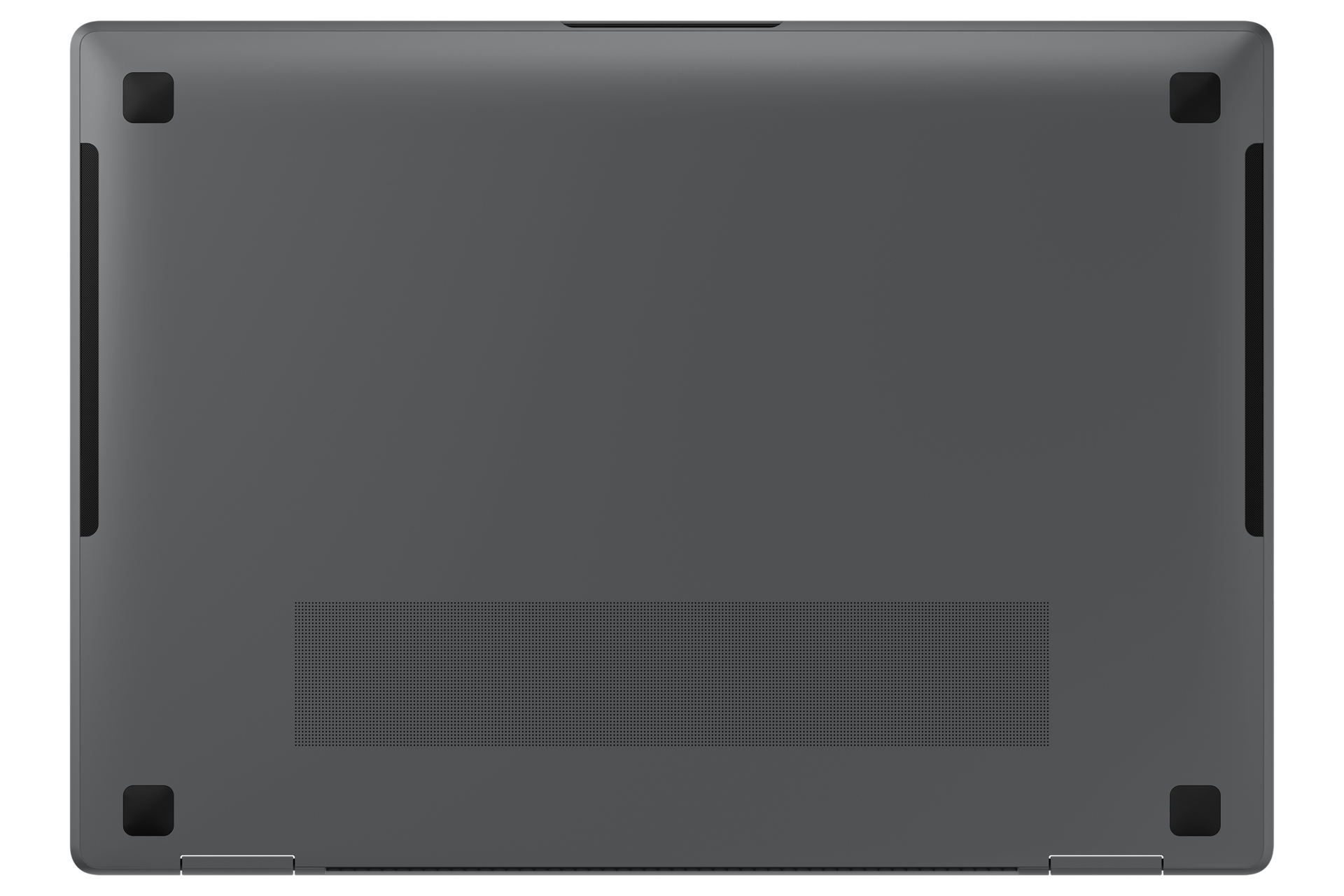 Spód szarego laptopa z czarnymi gumowymi nóżkami. Widoczne otwory wentylacyjne.