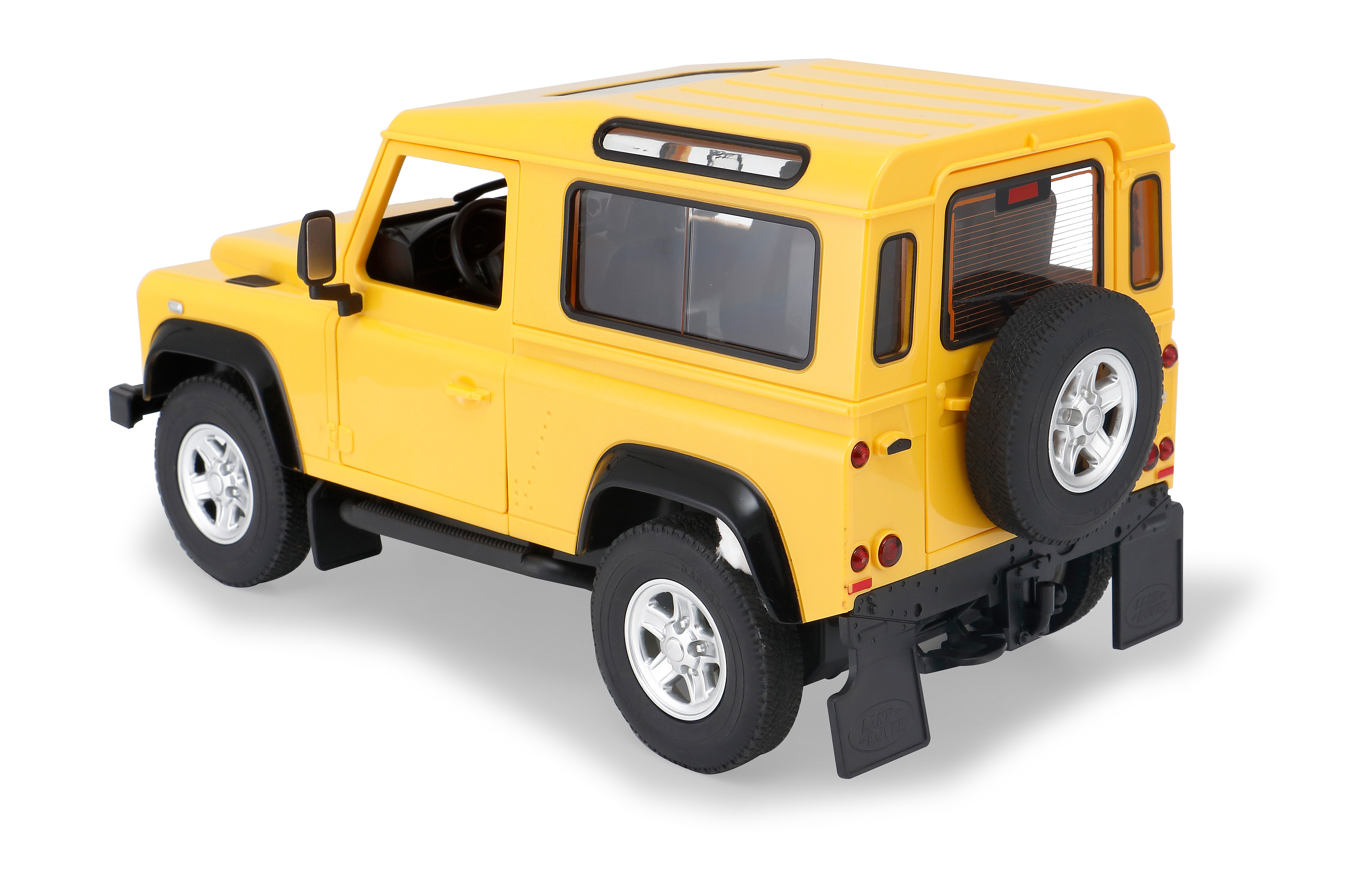 Rückansicht eines gelben Land Rover Defender Spielzeugautos auf weißem Untergrund.
