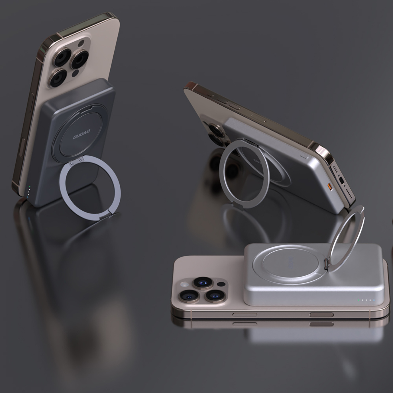 Pokazano trzy telefony z podkładkami ładującymi. Dwa telefony są ustawione pod kątem, jeden płasko, wszystkie pokazują ładowanie.