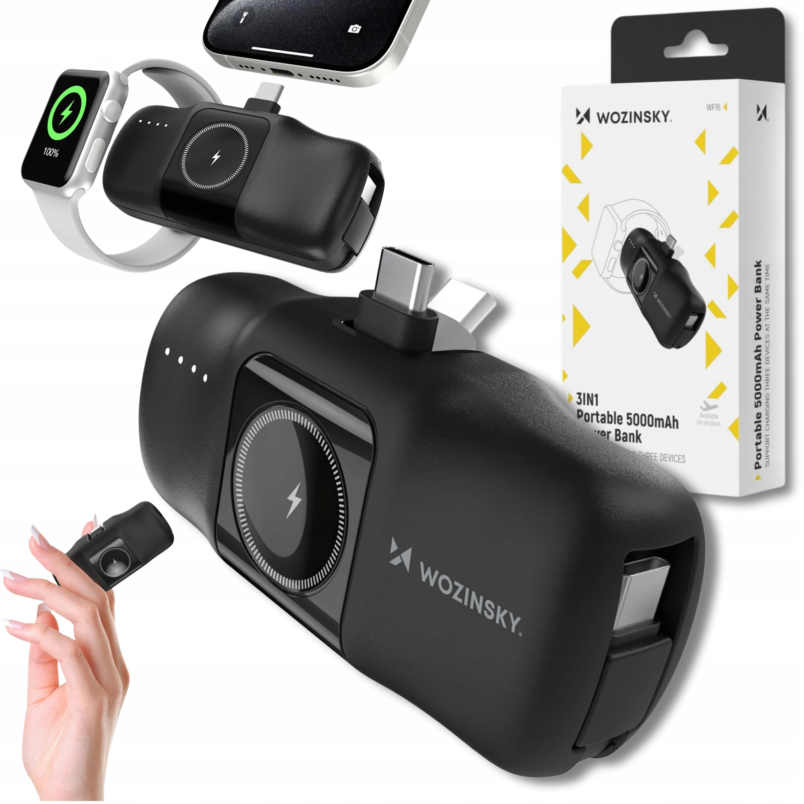 Czarny power bank z wieloma ładującymi się urządzeniami. Białe pudełko po prawej.