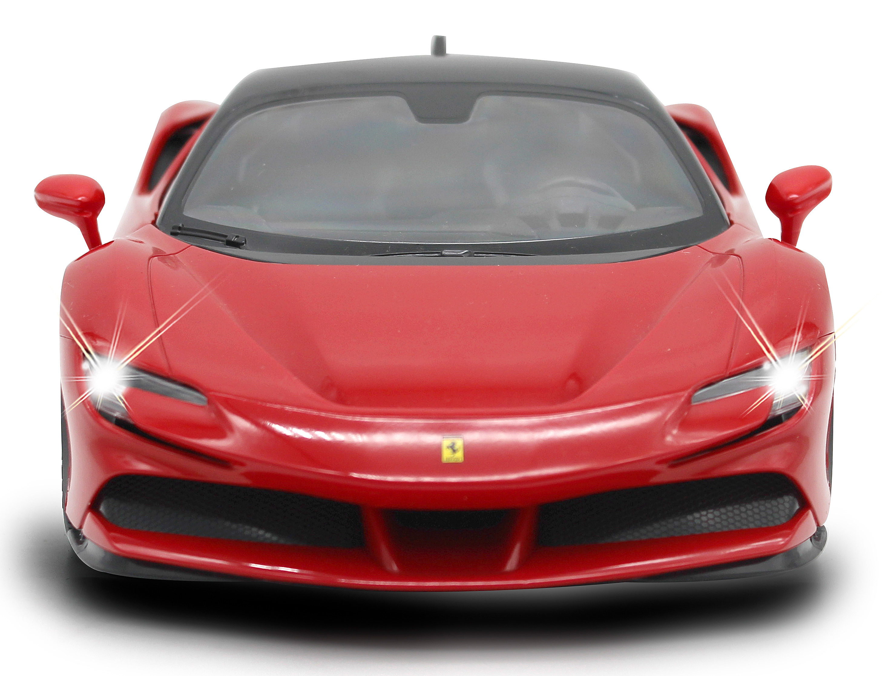 Rotes Ferrari-Spielzeugauto, Frontansicht. Das Auto hat Scheinwerfer an, schwarzes Dach.