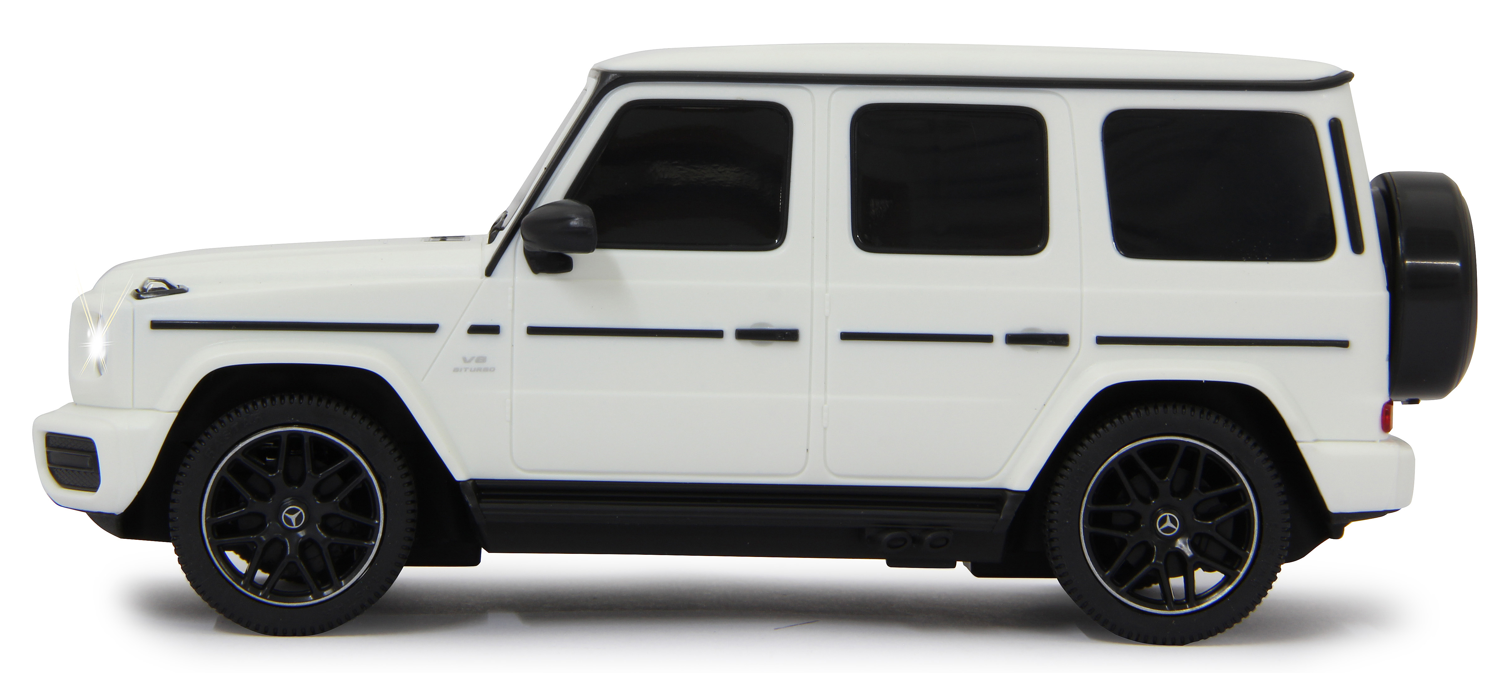 Weißes Mercedes-Benz G-Klasse Spielzeugauto mit schwarzen Rädern, einem Ersatzreifen und schwarzen Fenstern.