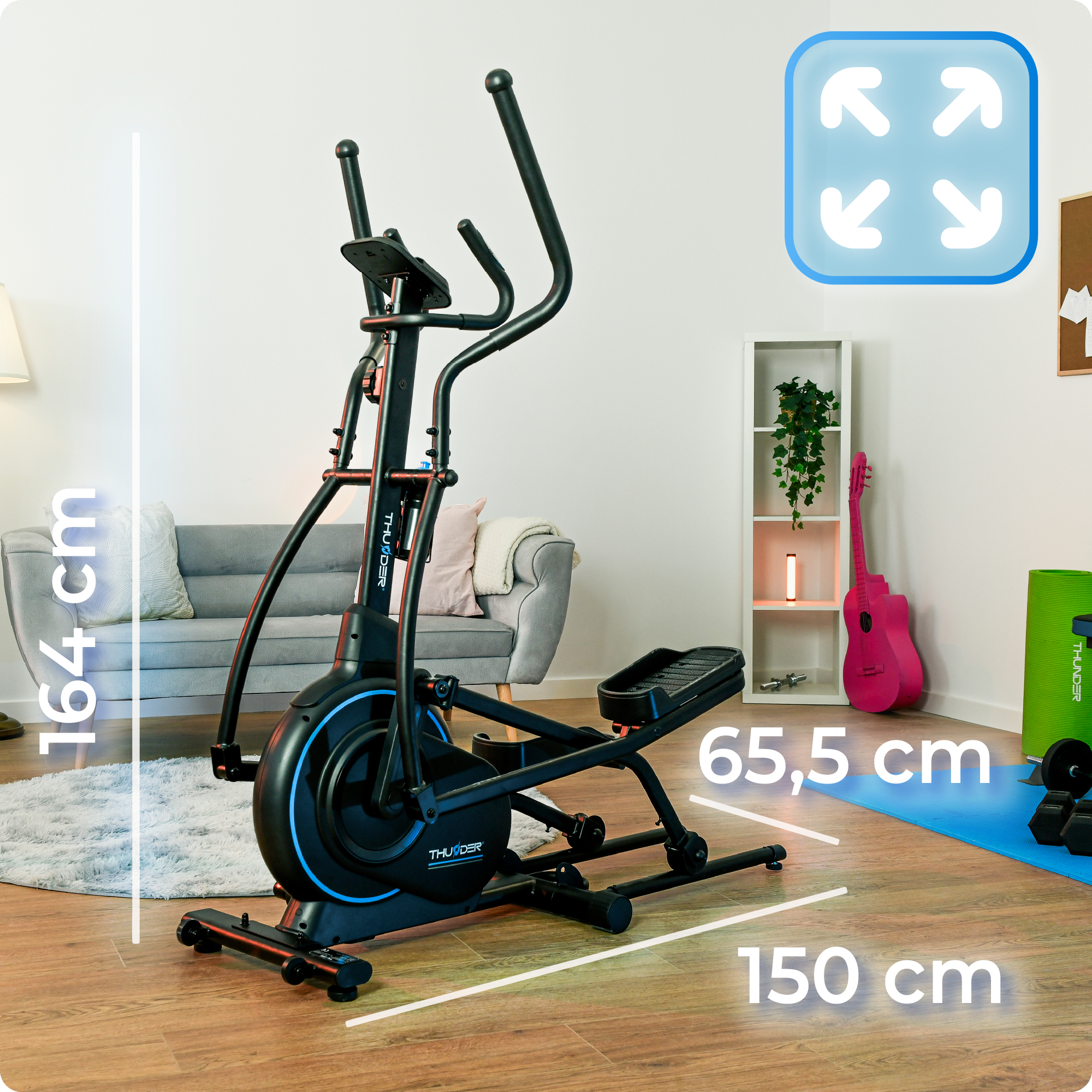 Orbitrek w pokoju. Wyświetlane są wymiary: 164 cm wysokości, 65,5 cm szerokości i 150 cm długości.