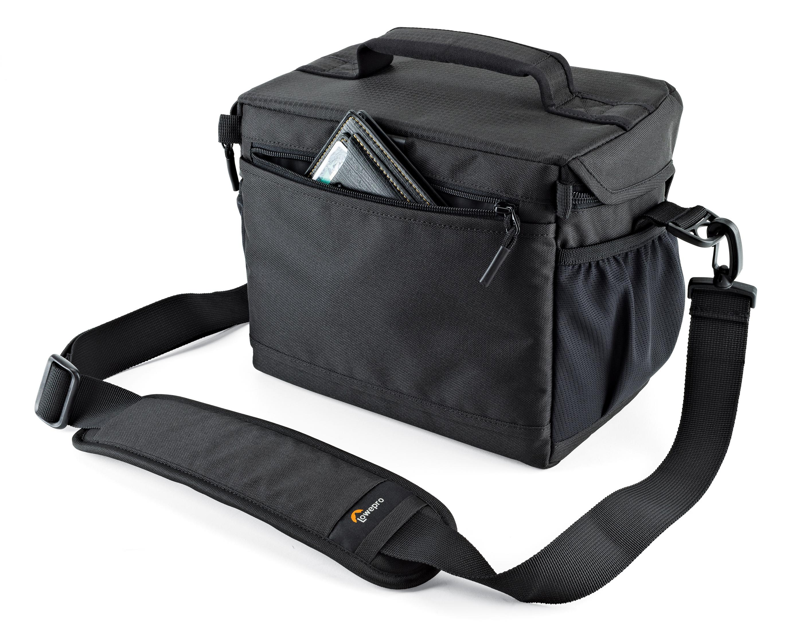 A black camera bag with a wallet in the pocket. It has a handle and a shoulder strap.