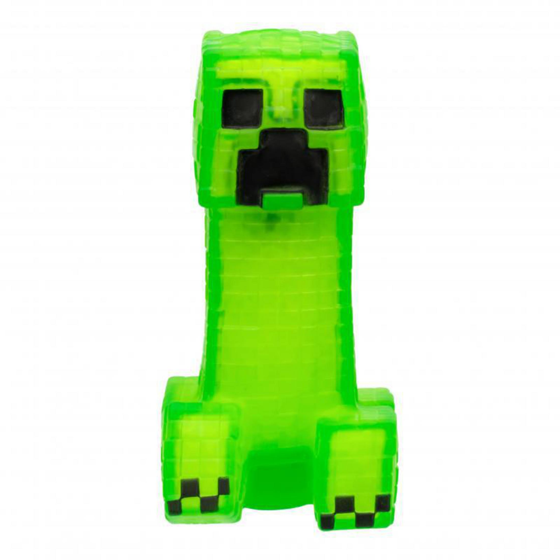 Una figura verde de Creeper de Minecraft, con rasgos faciales negros y un cuerpo rectangular, de pie.