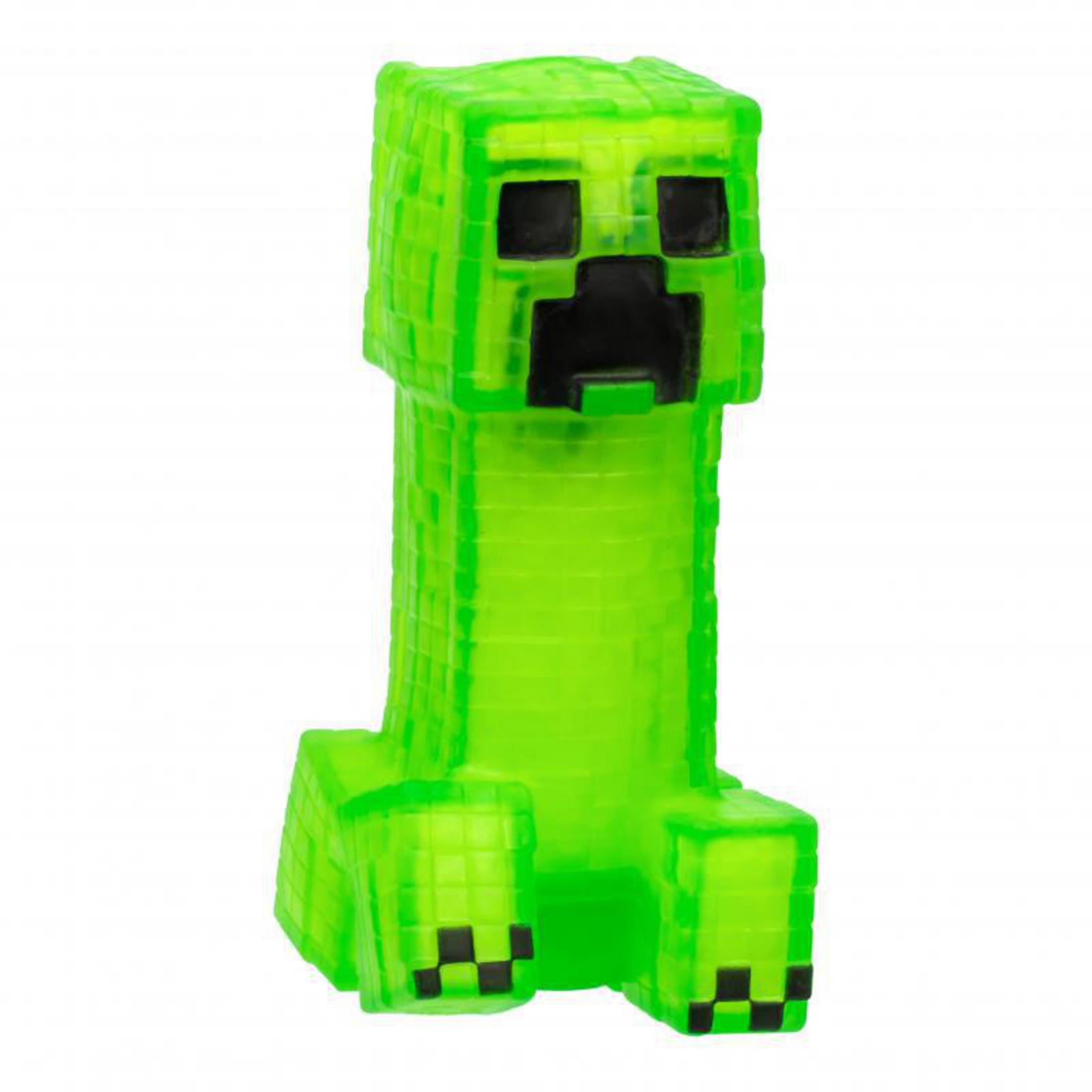 Una figura verde de Creeper de Minecraft de pie. Tiene un cuerpo cuadrado y rasgos faciales negros.