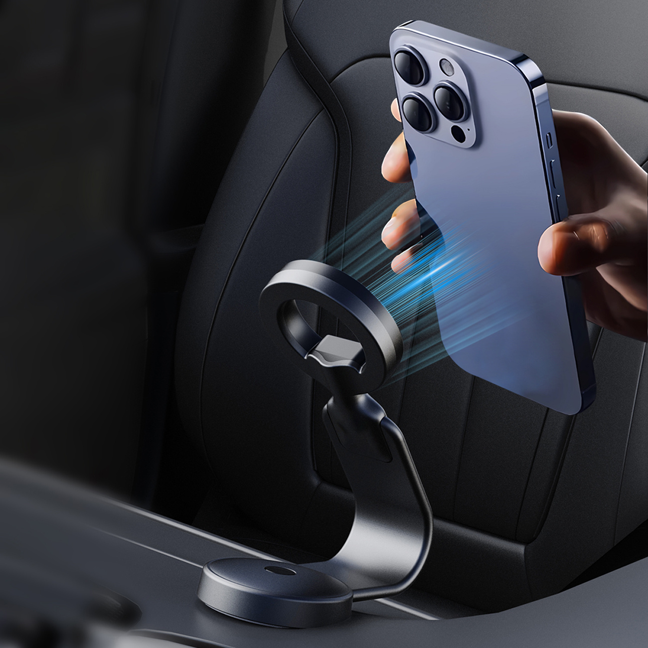 Wnętrze samochodu z telefonem przymocowanym do czarnego uchwytu samochodowego. Telefon jest niebieski.