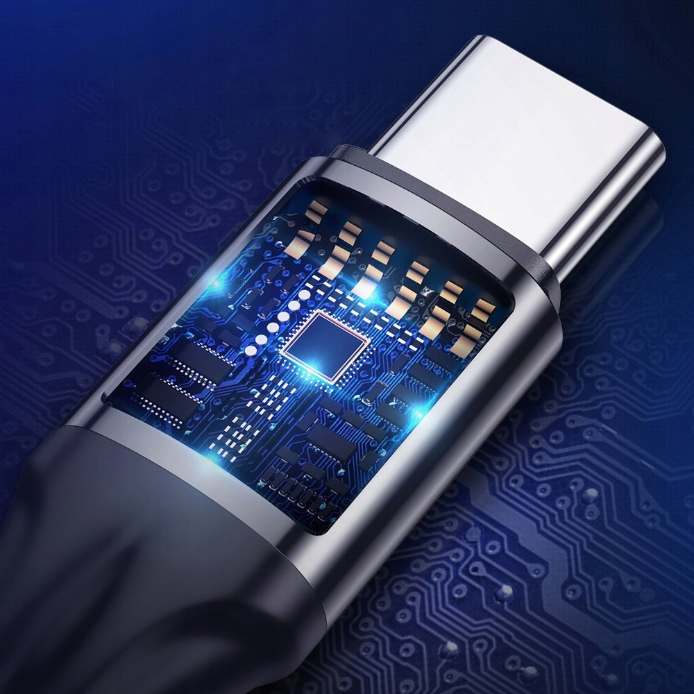 Zbliżenie złącza USB-C. Złącze jest podłączone do płytki drukowanej z niebieskimi światłami.