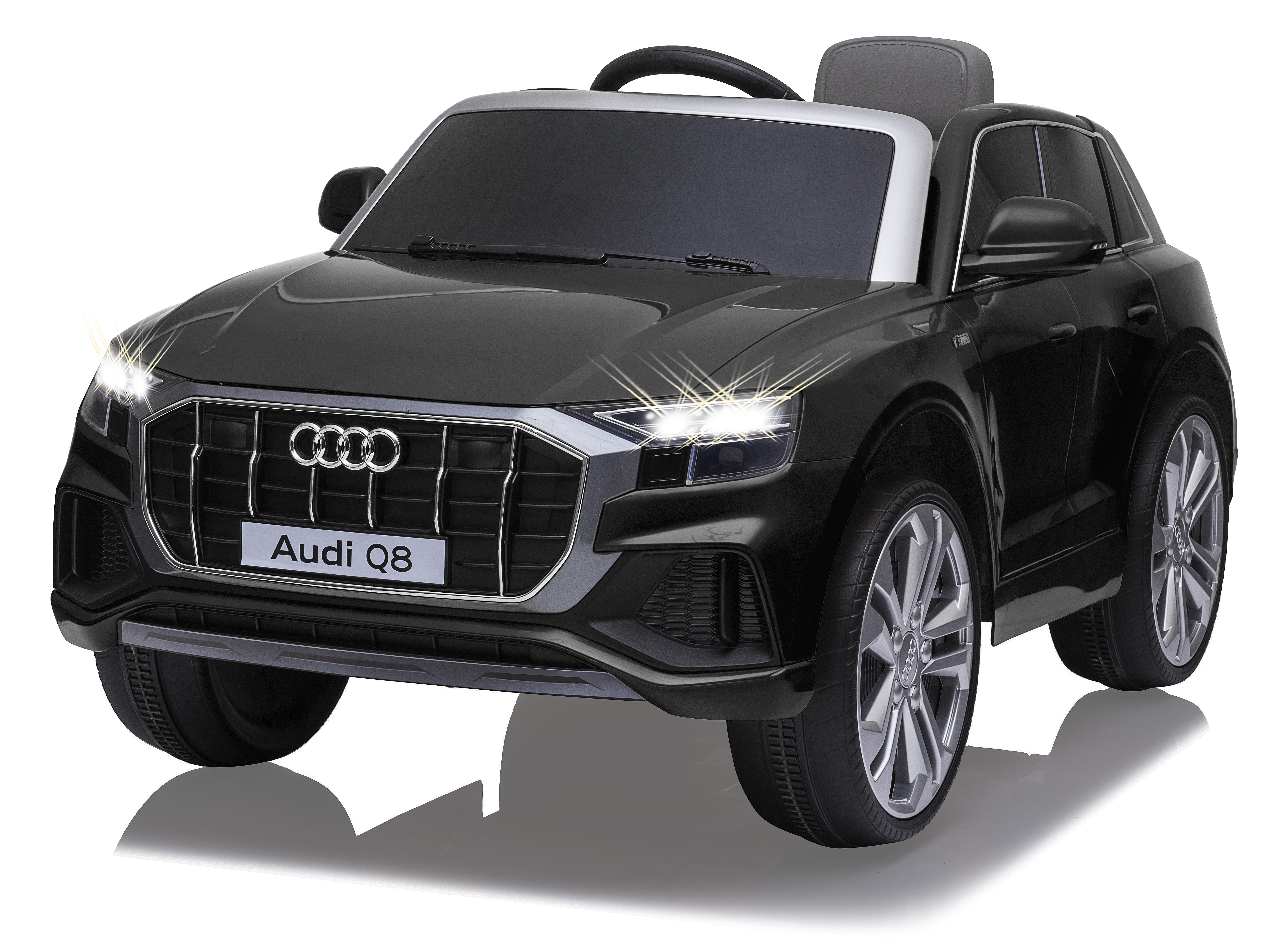 Ein schwarzes Audi Q8 Spielzeugauto mit weißem Dach und beleuchteten Scheinwerfern.