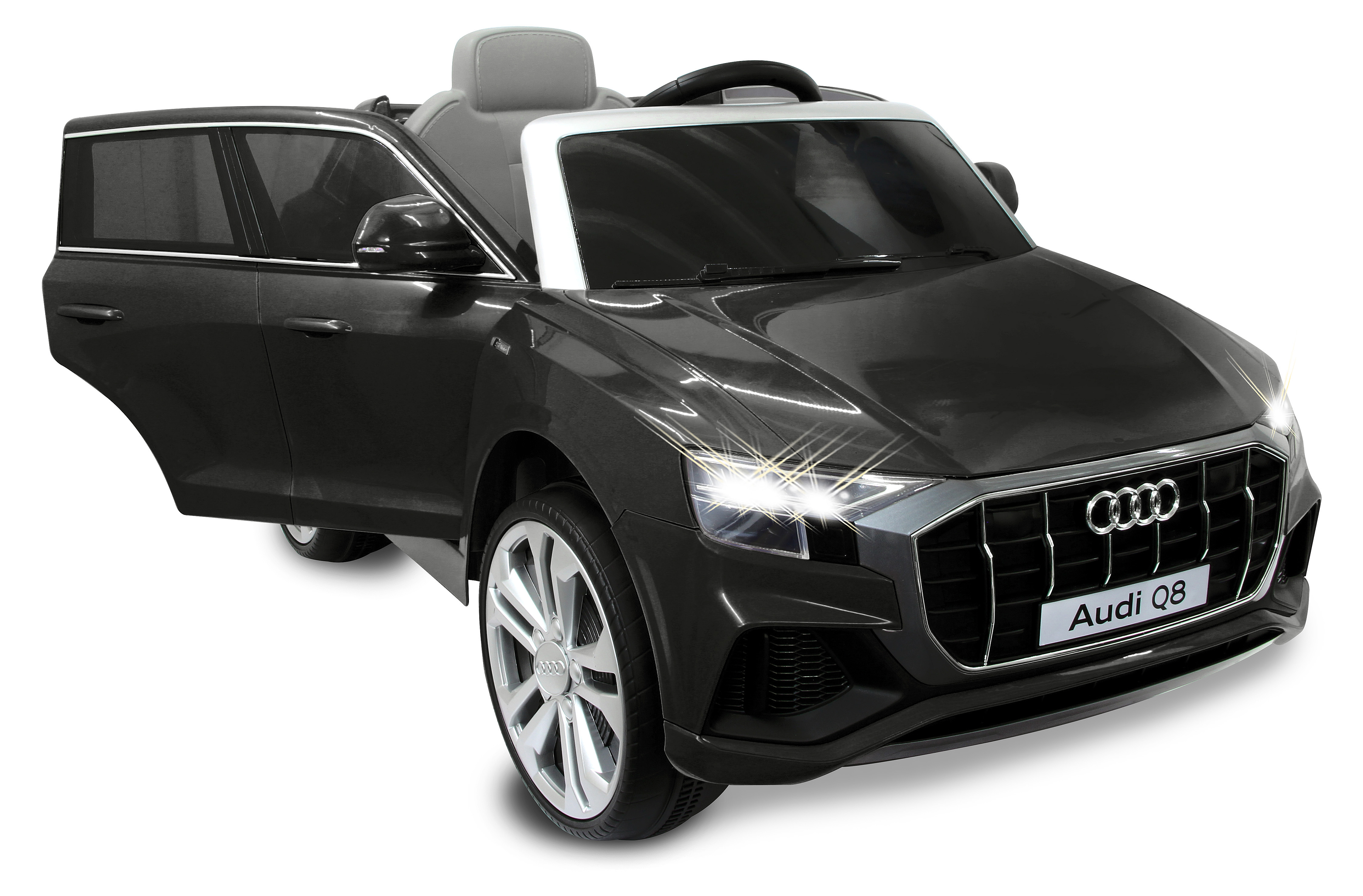 Ein graues Audi Q8 Spielzeugauto mit offener Fahrertür, weißem Dach und silbernen Felgen.