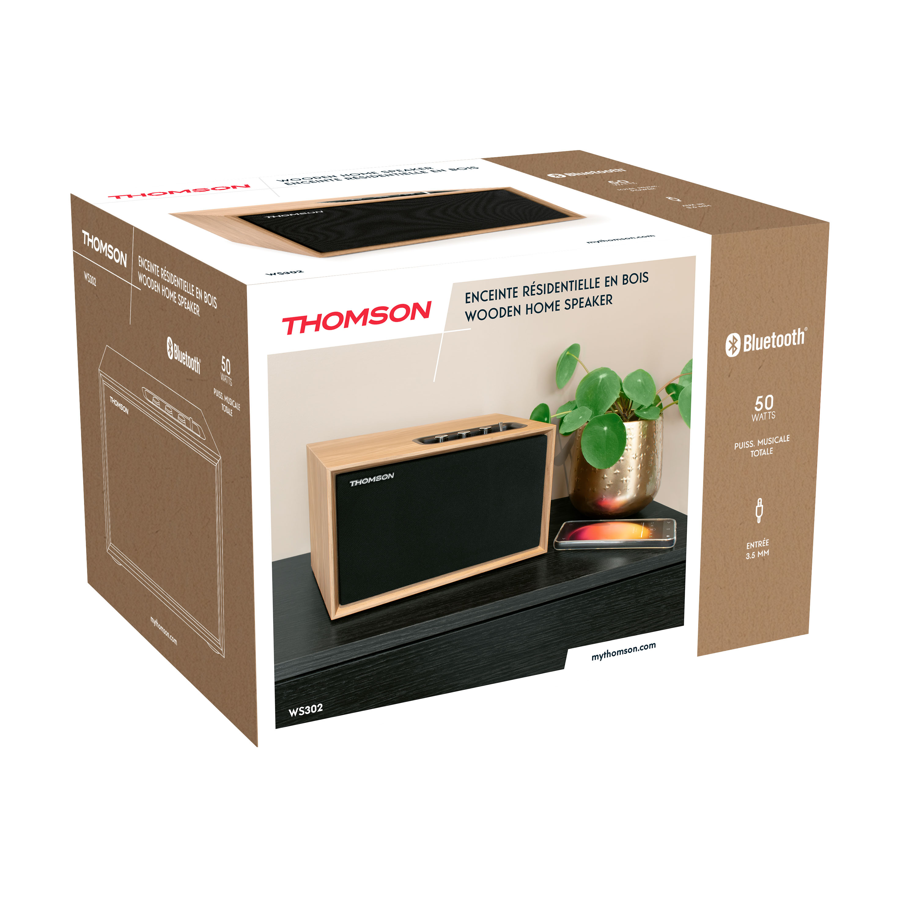 Kartown z drewnianym głośnikiem domowym, telefonem i rośliną. Napis na pudełku: Thomson.