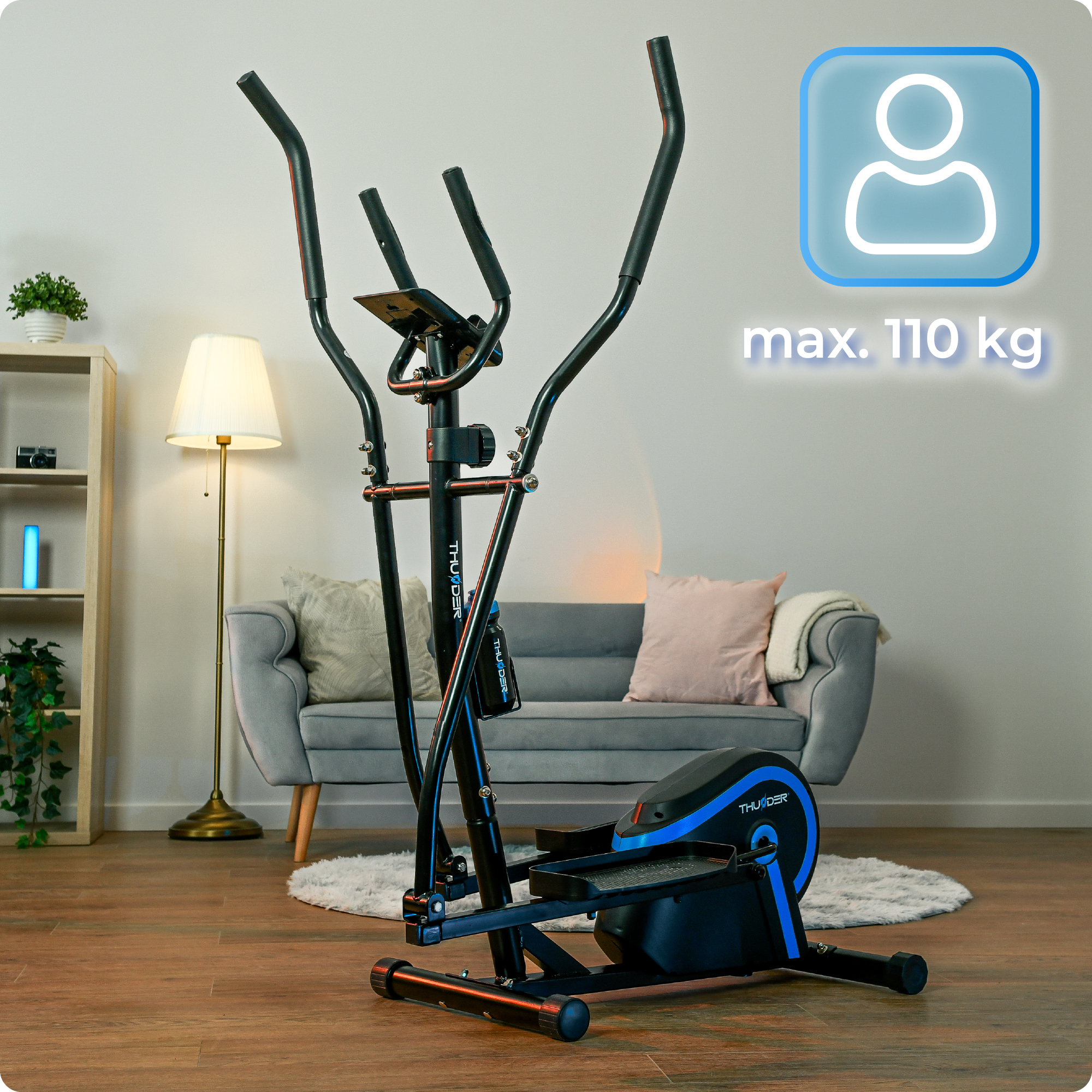 Maszyna eliptyczna o maksymalnej wadze 110 kg. Maszyna jest czarna i niebieska.