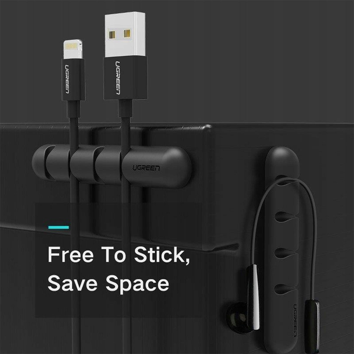 Czarna stacja ładująca do kabli USB i słuchawek. Biały tekst: Free To Stick, Save Space.