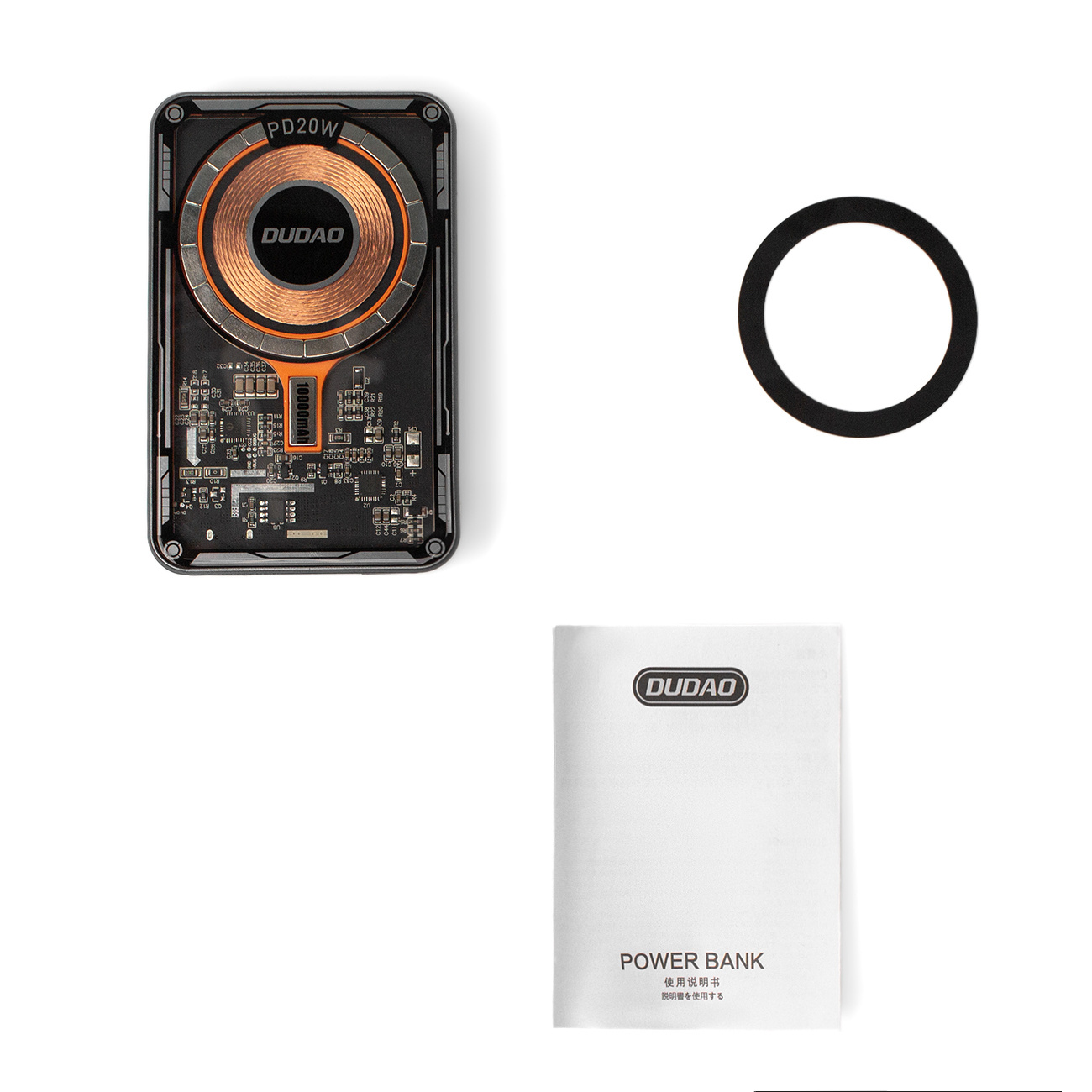 Power bank, czarny pierścień i biała instrukcja na białym tle.