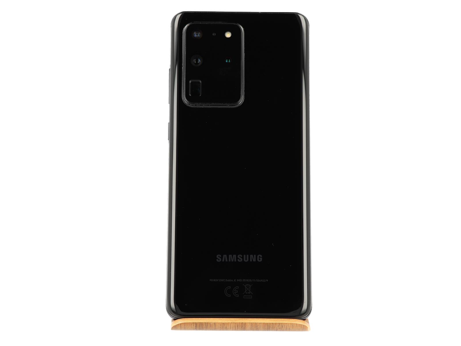 Dos de téléphone Samsung noir avec caméras et marque sur support en bois, fond blanc.