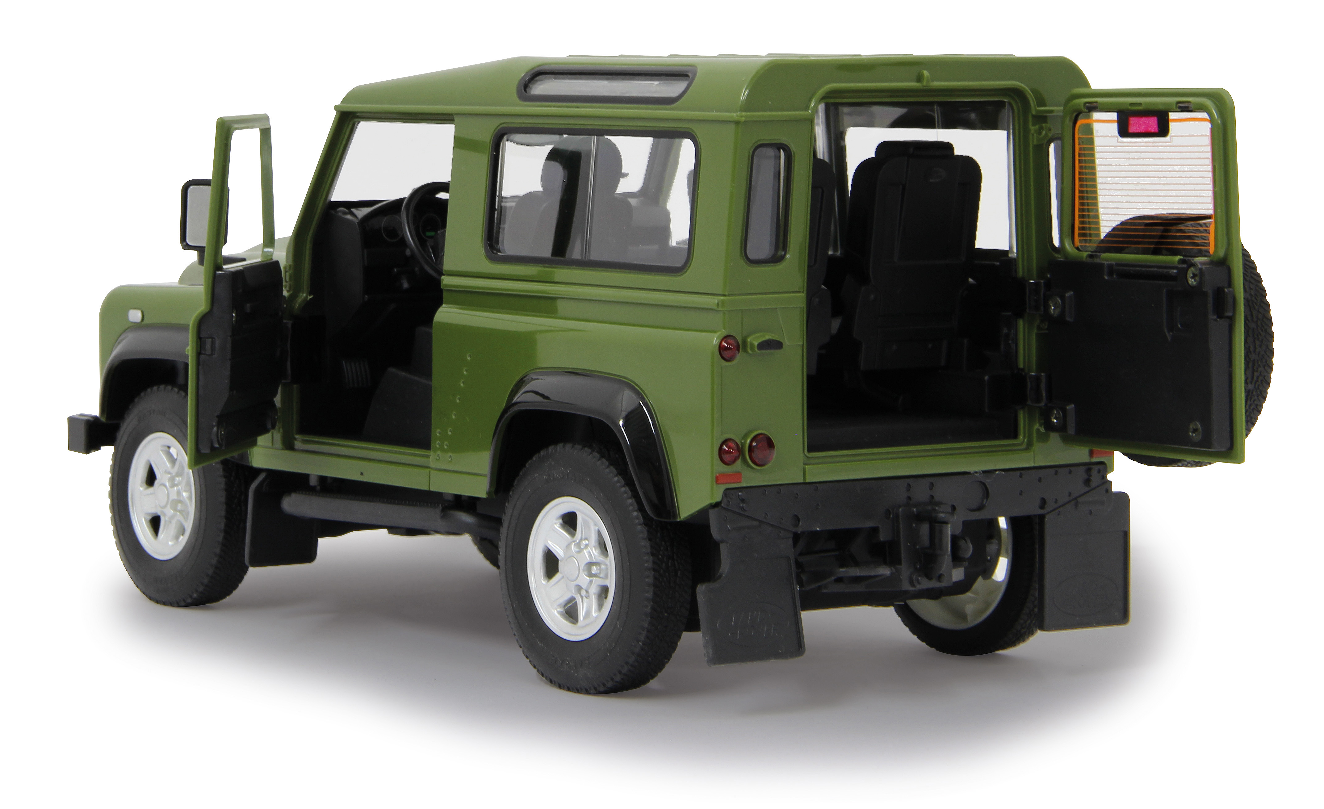 Ein grünes Land Rover Defender Spielzeugauto mit offenen Türen und Reserverad hinten auf weißem Hintergrund.