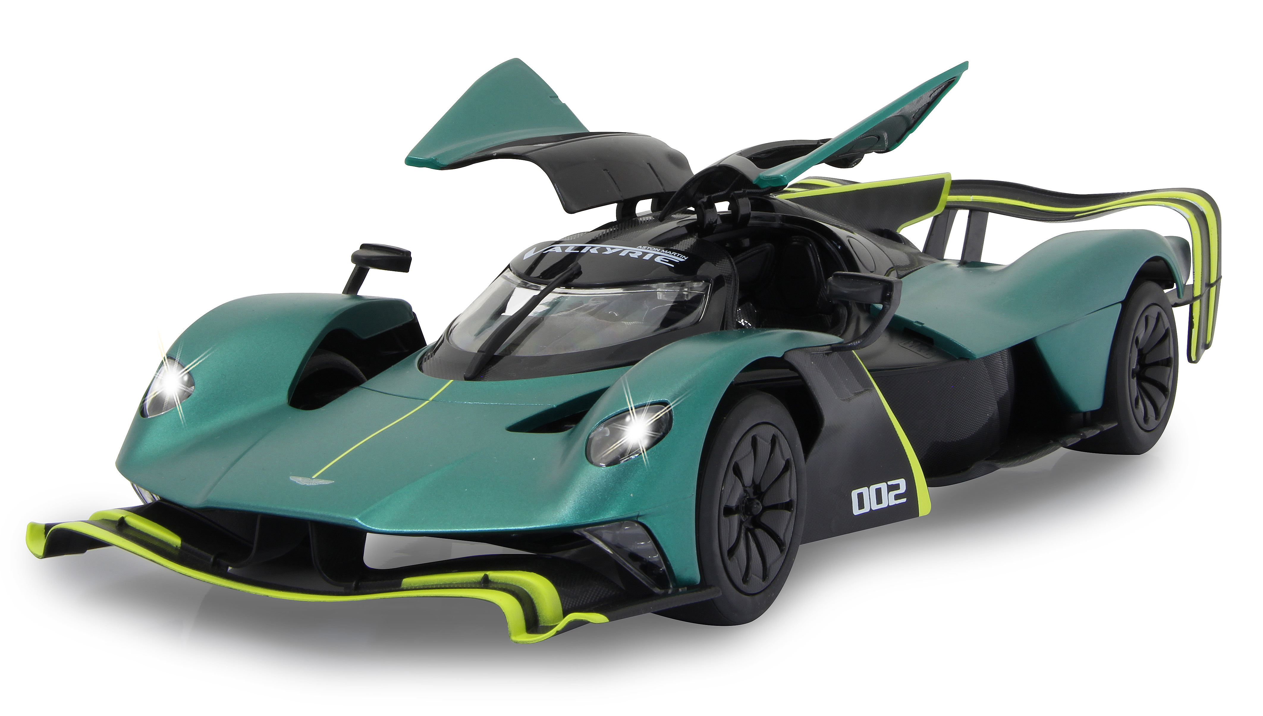 Grünes und schwarzes Aston Martin Valkyrie Spielzeugauto mit offenen Türen und eingeschalteten Scheinwerfern.