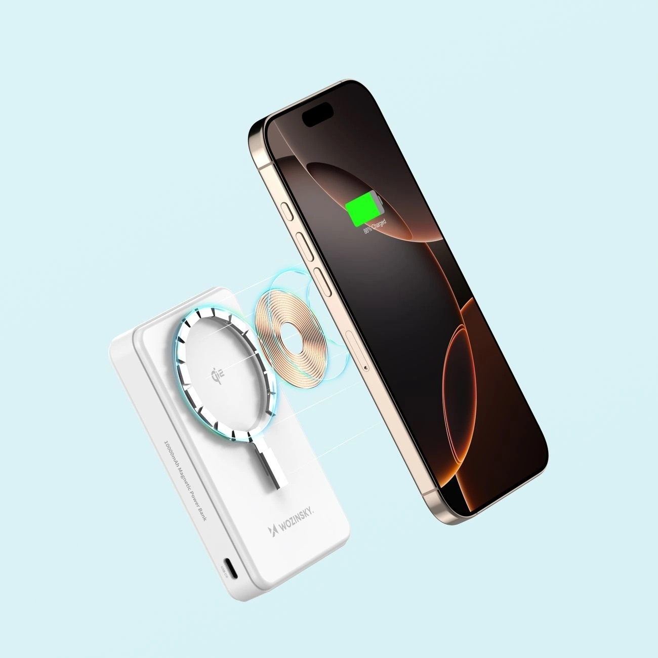 Telefon i power bank z bezprzewodowym połączeniem ładowania. Power bank jest biały.