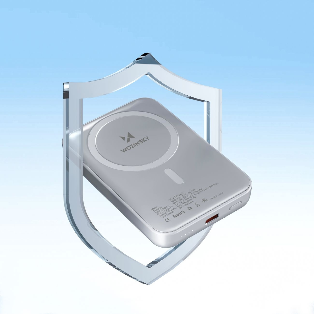 Srebrny power bank z logo Wozinsky, otoczony ilustracją tarczy.