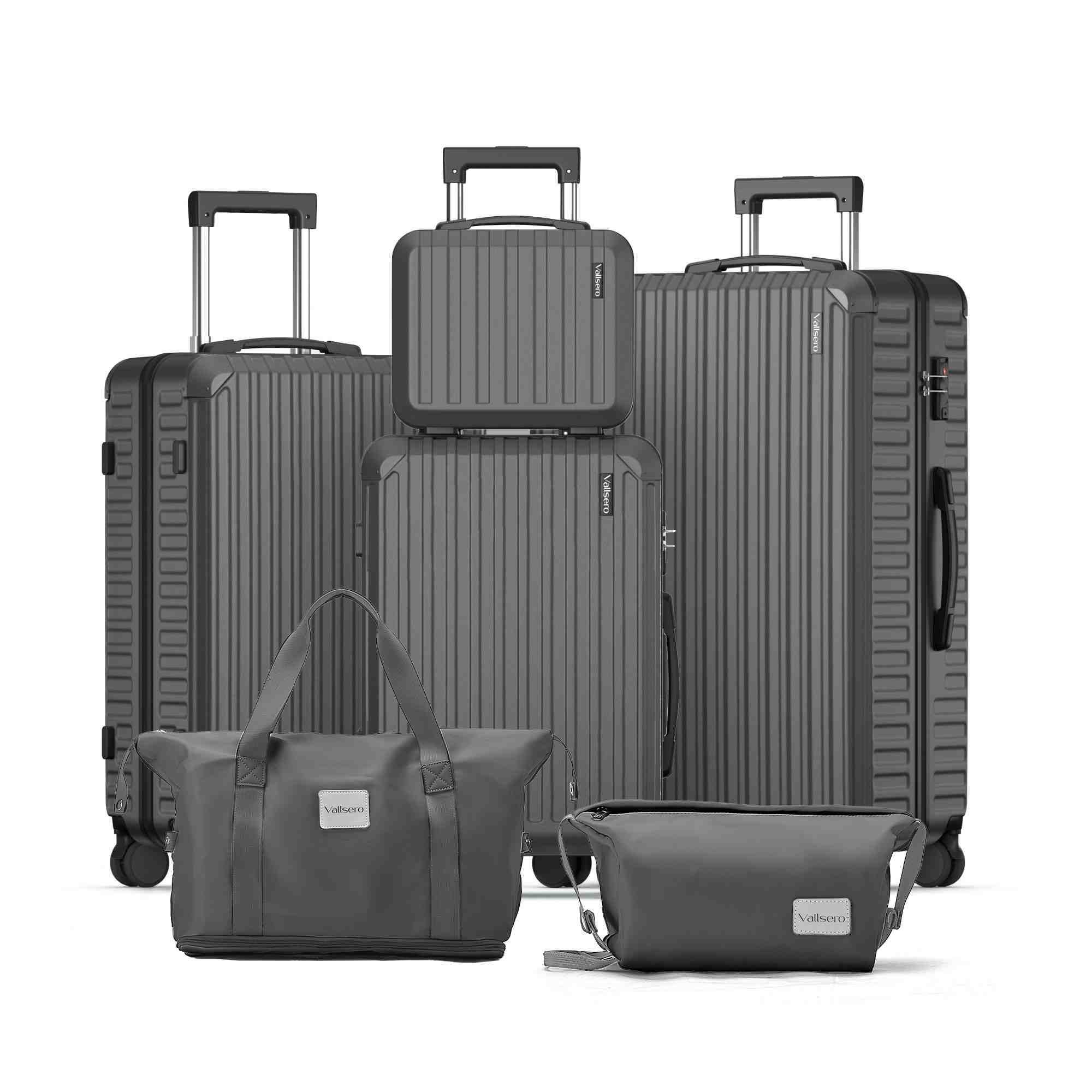 Zestaw szarego bagażu: dwie walizki pionowe, bagaż podręczny, torba i mniejsza torba.