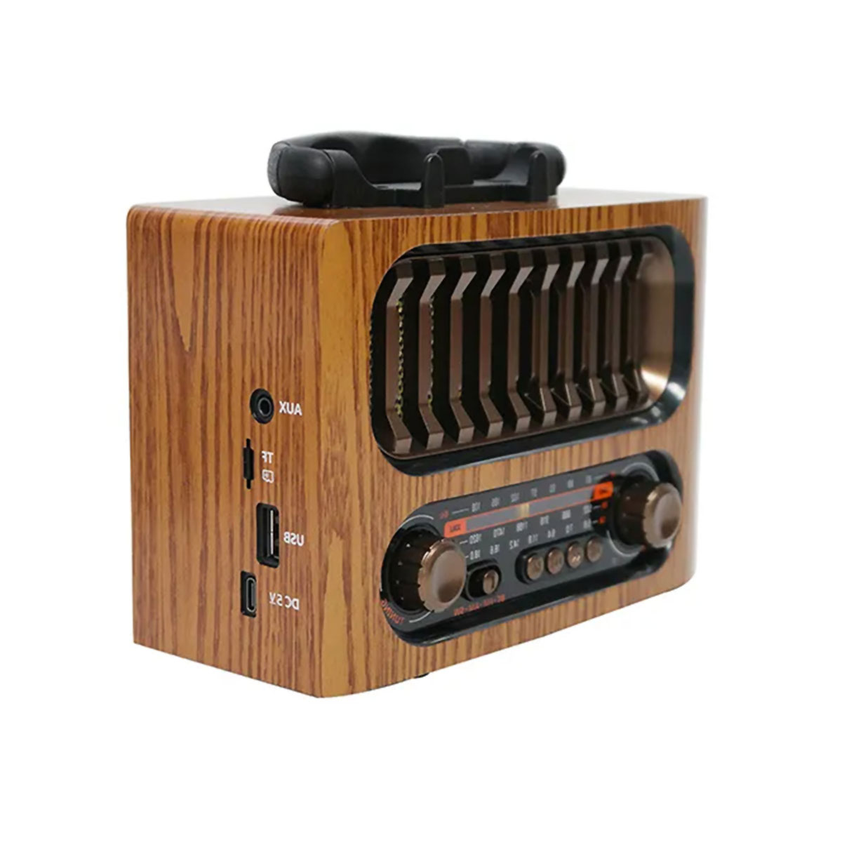 Radio de madera con asa y dos diales. Tiene puertos USB y AUX. Rejilla de altavoz negra.