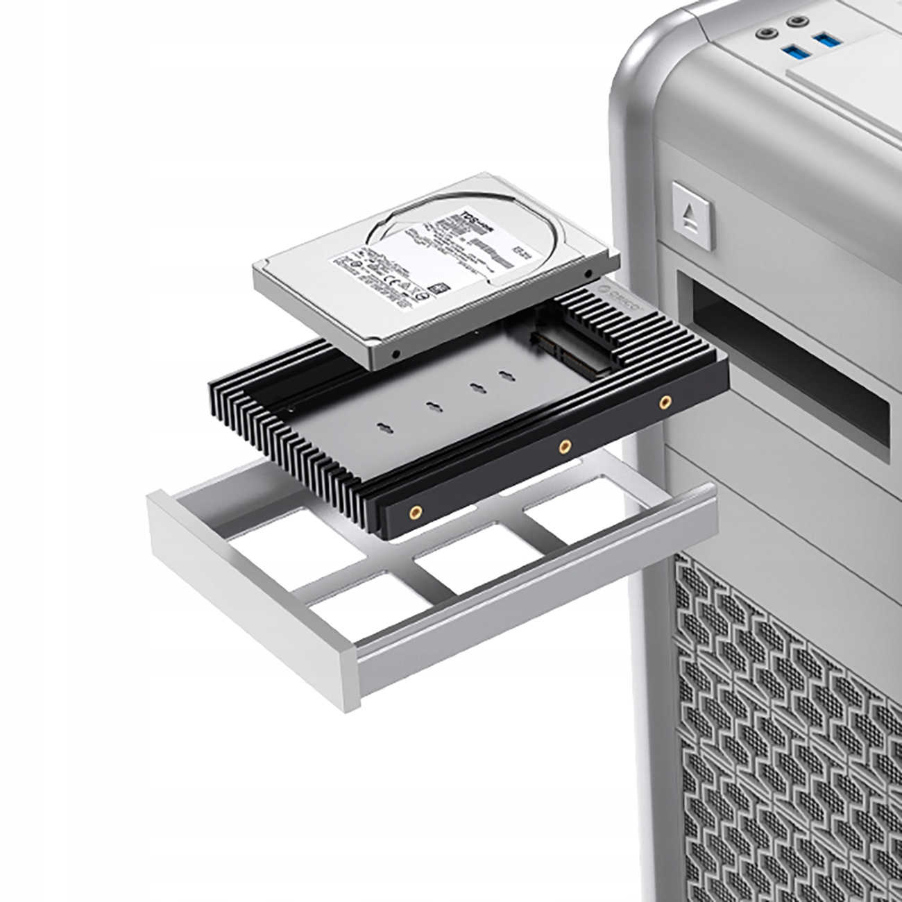 Elementy komputera, w tym dysk twardy, radiator i srebrna obudowa.