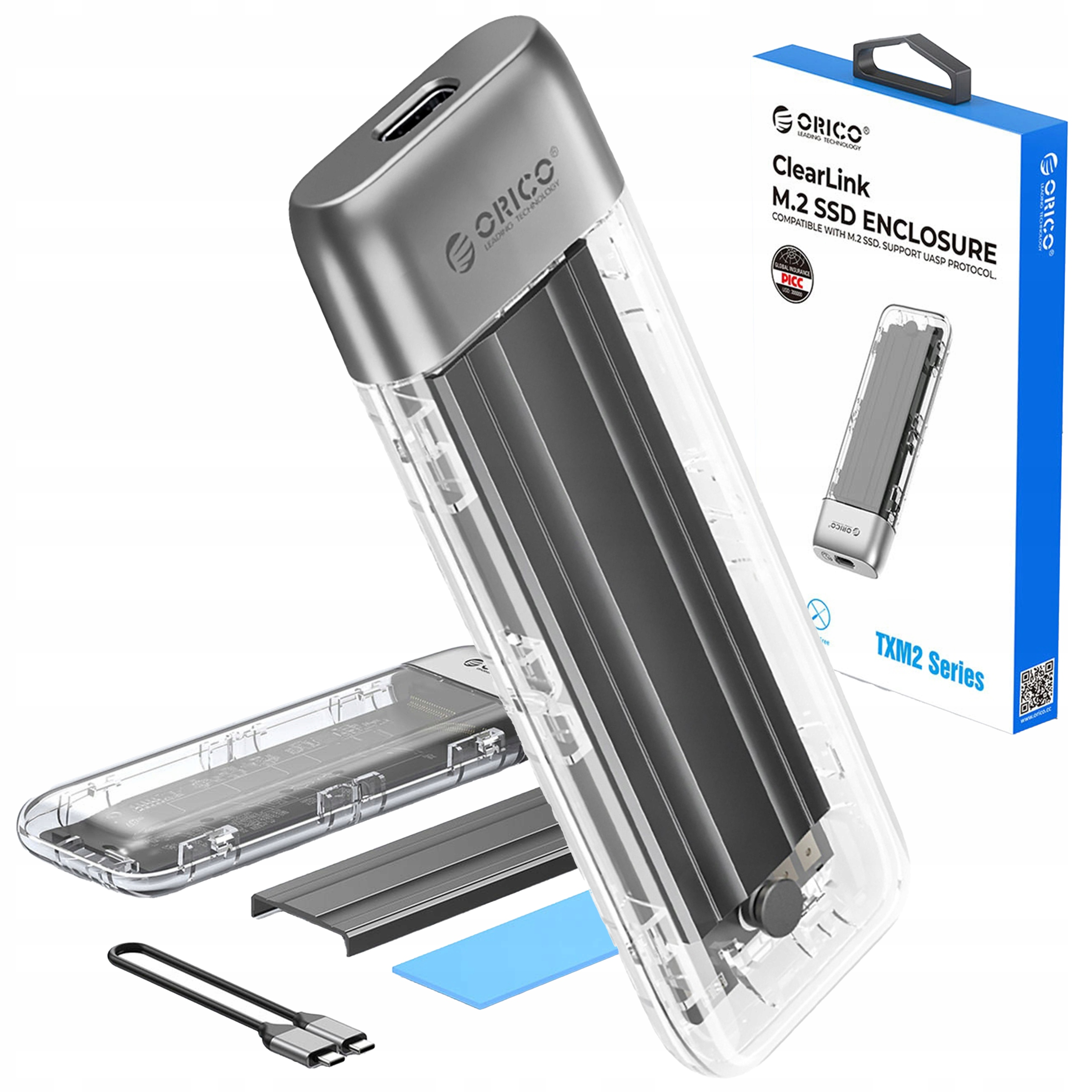 Obudowa SSD z akcesoriami. Widoczna nazwa marki „ORICO”. Produkt to seria TXM2.