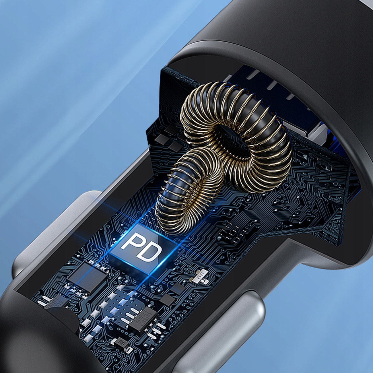 Zbliżenie ładowarki samochodowej z płytką obwodu i złotą cewką, z logo PD.