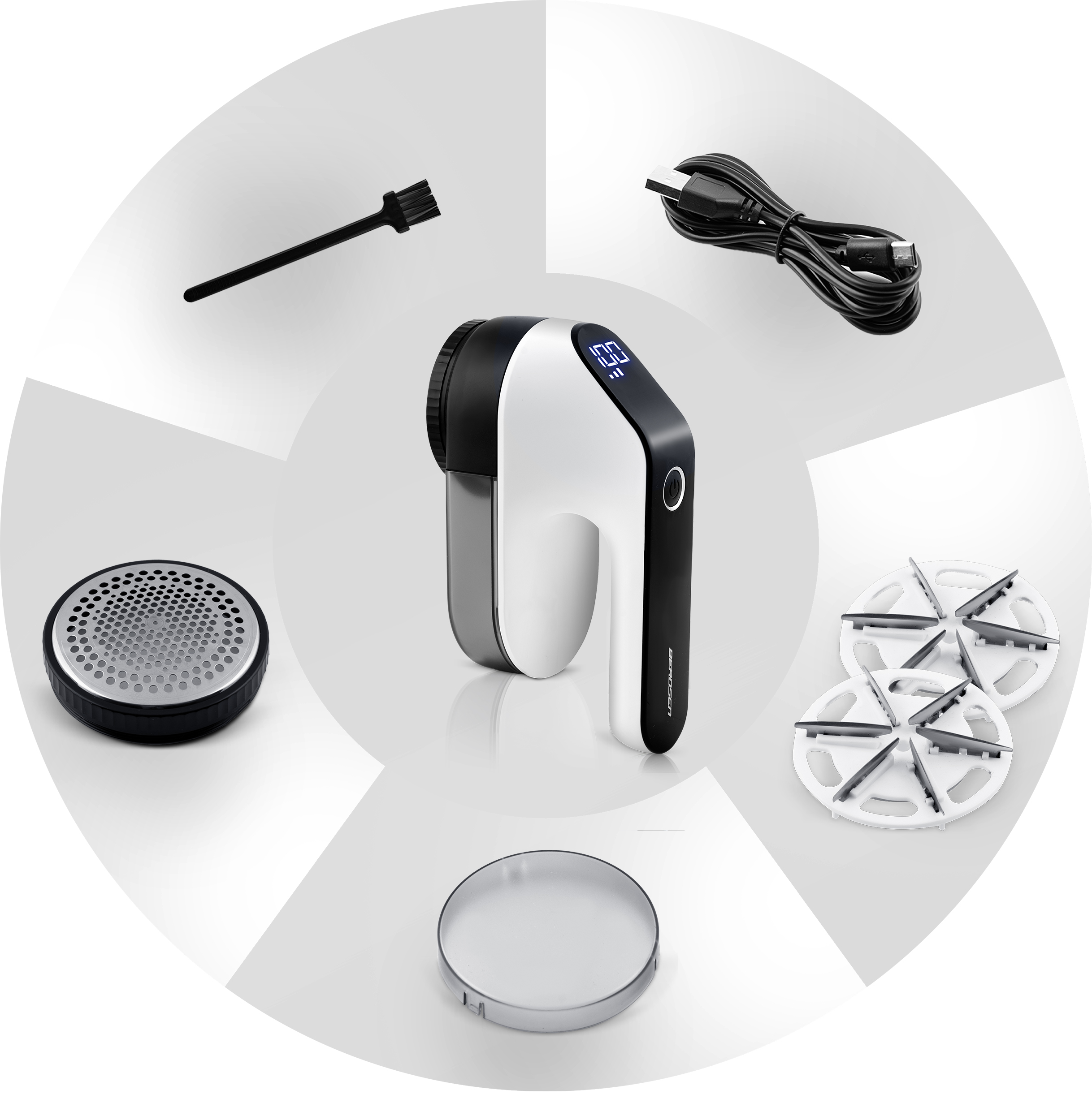 Golarka do tkanin i jej akcesoria, ułożone w okrąg. Golarka jest biało-czarna.