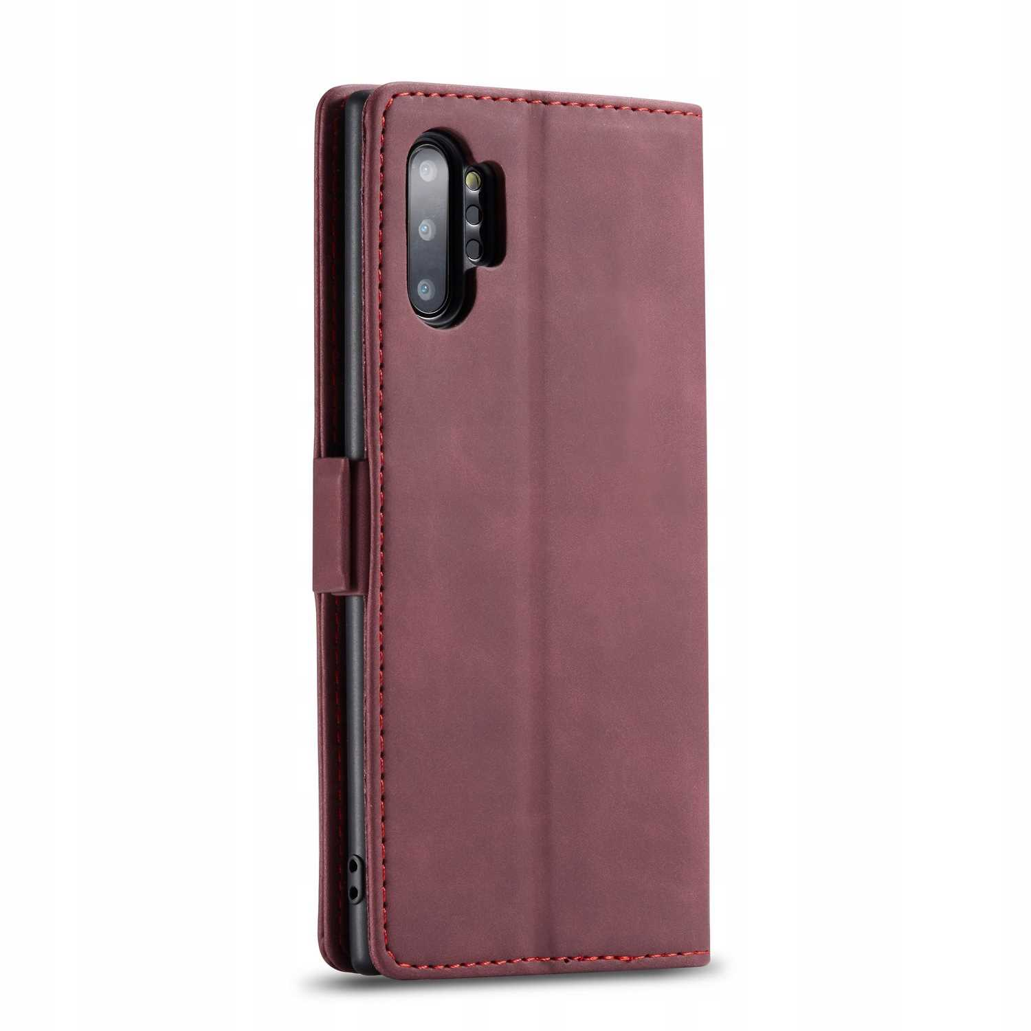 Bordowe etui na telefon, zamknięte, z czerwonymi szwami. Widoczny aparat telefonu.