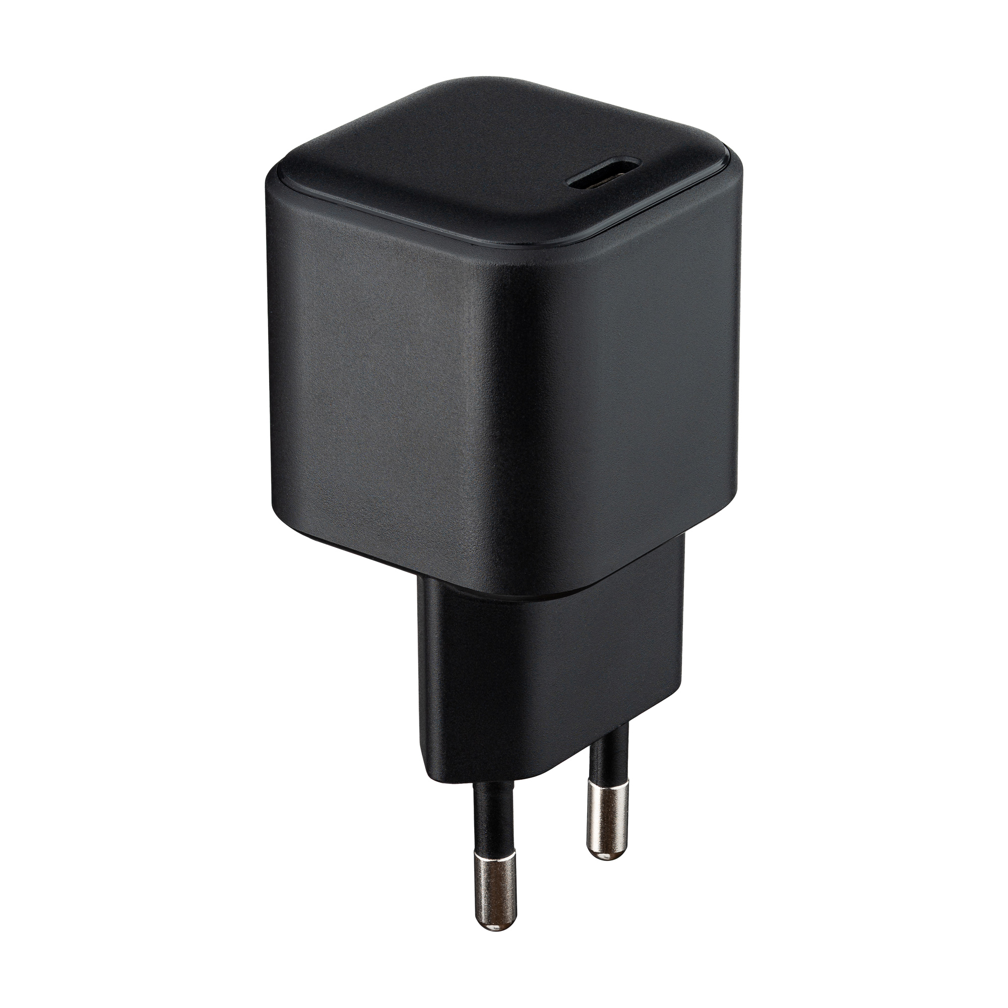 Czarny zasilacz z dwoma metalowymi bolcami. Jest to małe, kwadratowe urządzenie.