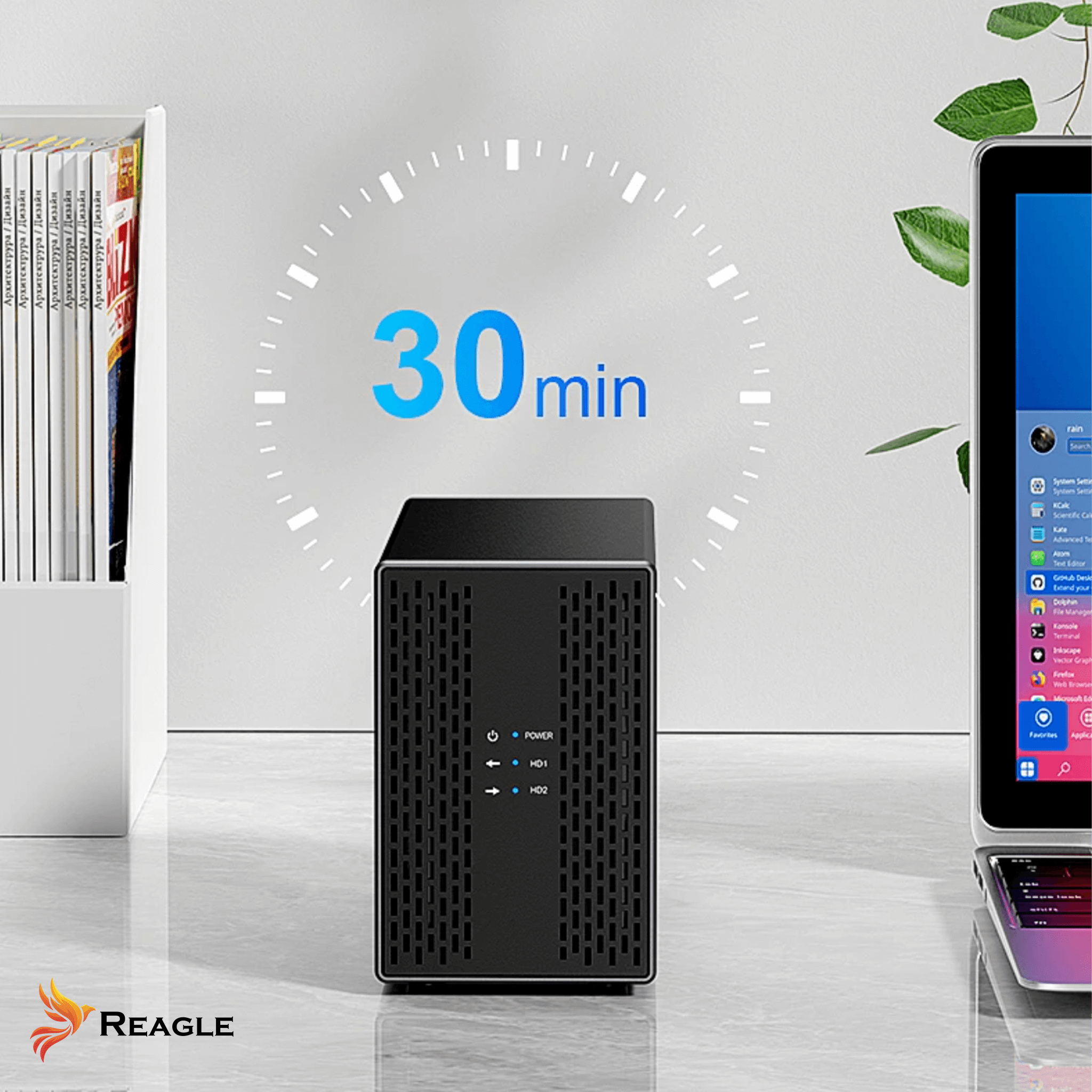 Czarne urządzenie z ekranem obok laptopa. Tekst: 30 min. i logo Reagle. Widoczne porty zasilania i HDD.