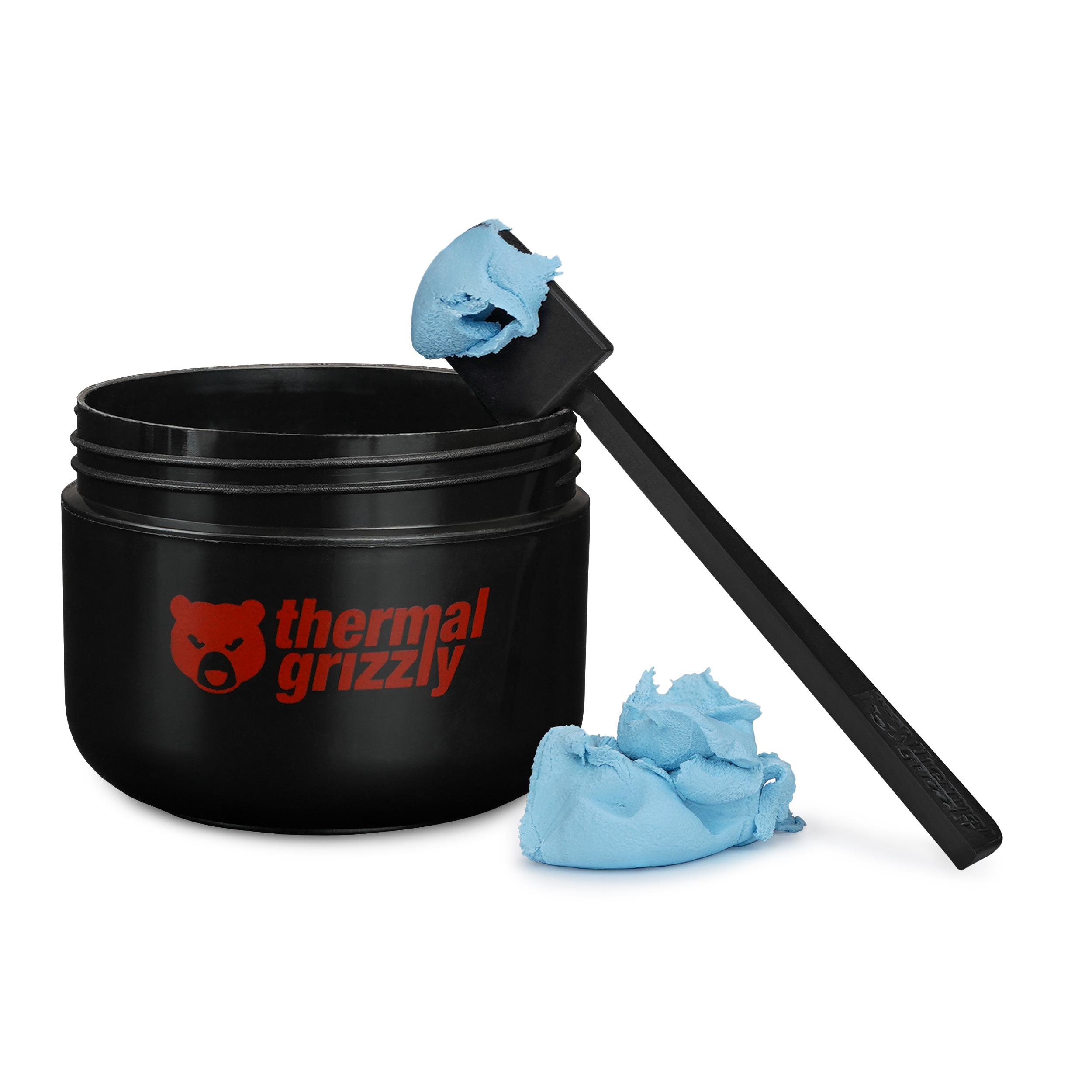 Schwarzer Wärmeleitpastentiegel mit blauer Paste und Spatel. Thermal Grizzly Logo sichtbar.
