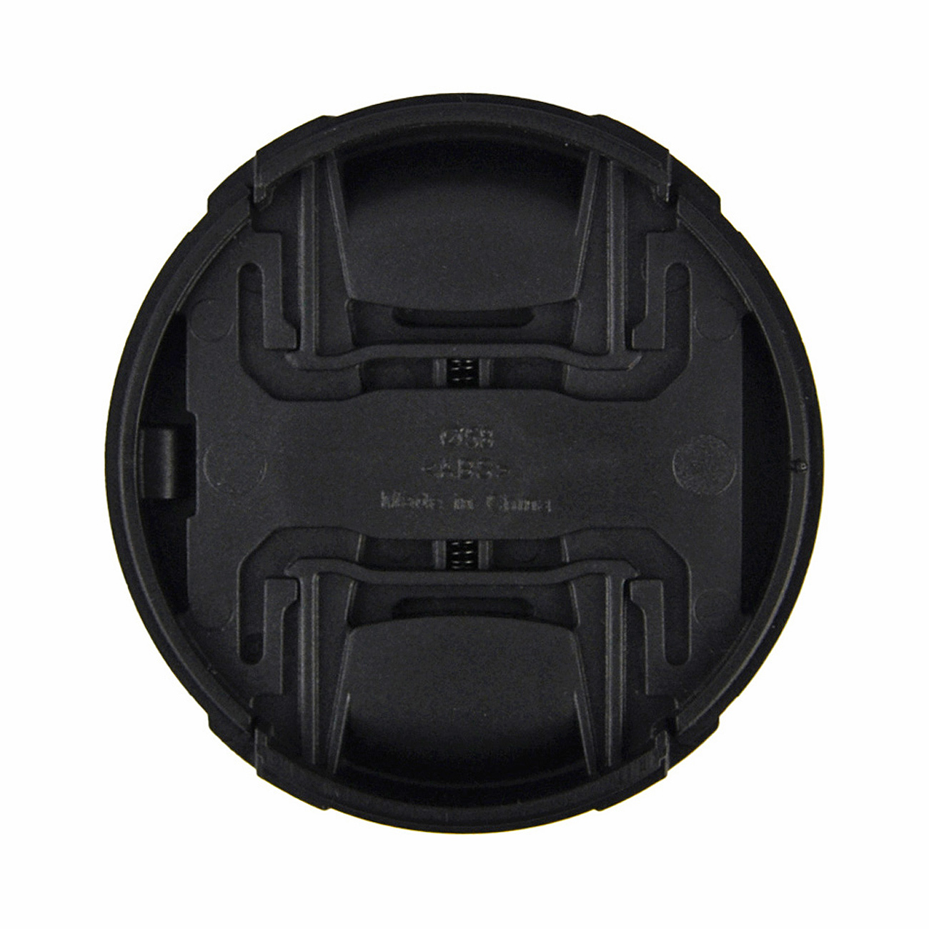 Die Rückseite einer schwarzen Objektivkappe. Sie hat eine matte Oberfläche und besteht aus ABS-Kunststoff.