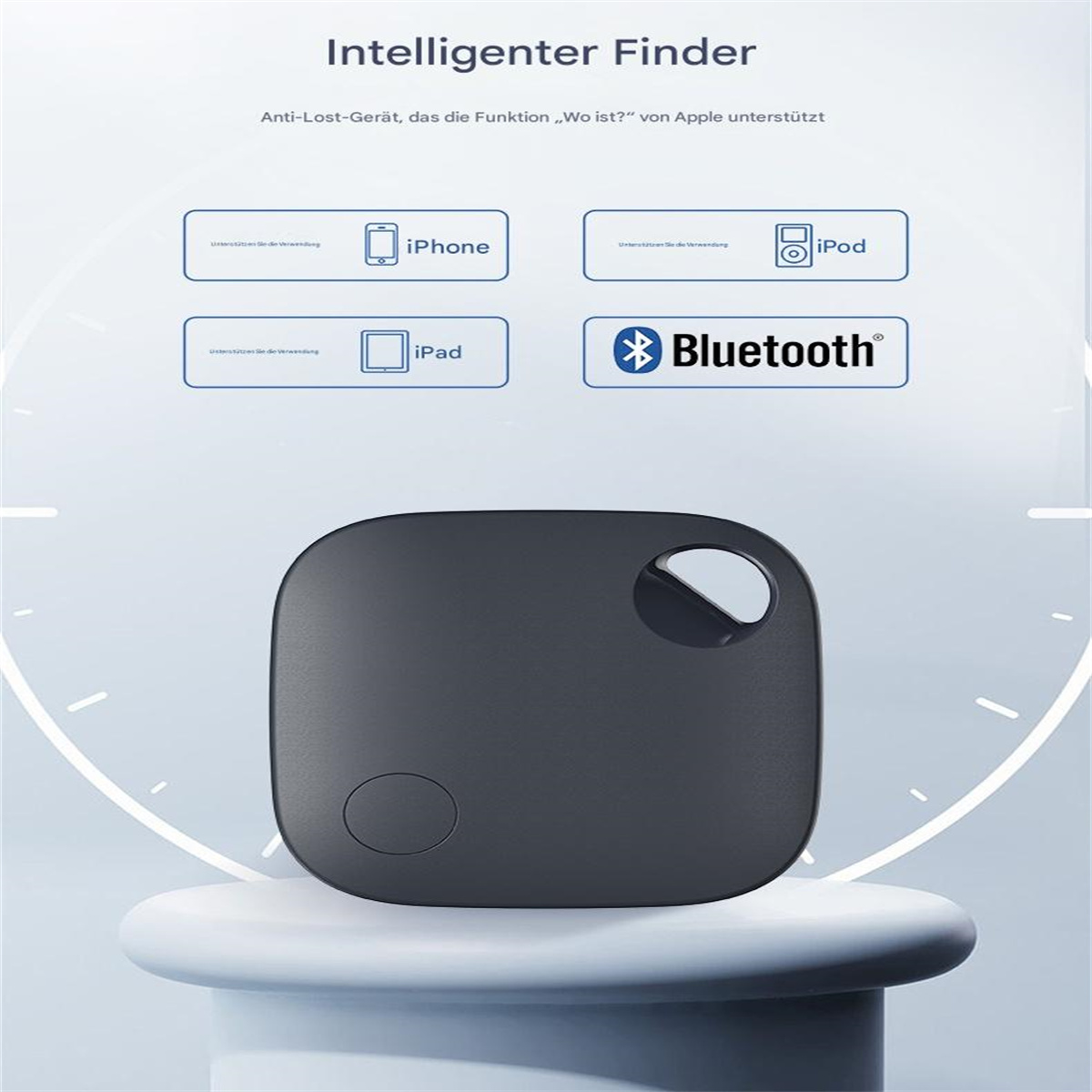 Ein dunkelgrauer Tracker auf einem weißen Ständer, mit Text in Deutsch, der sich auf Apple-Geräte bezieht.